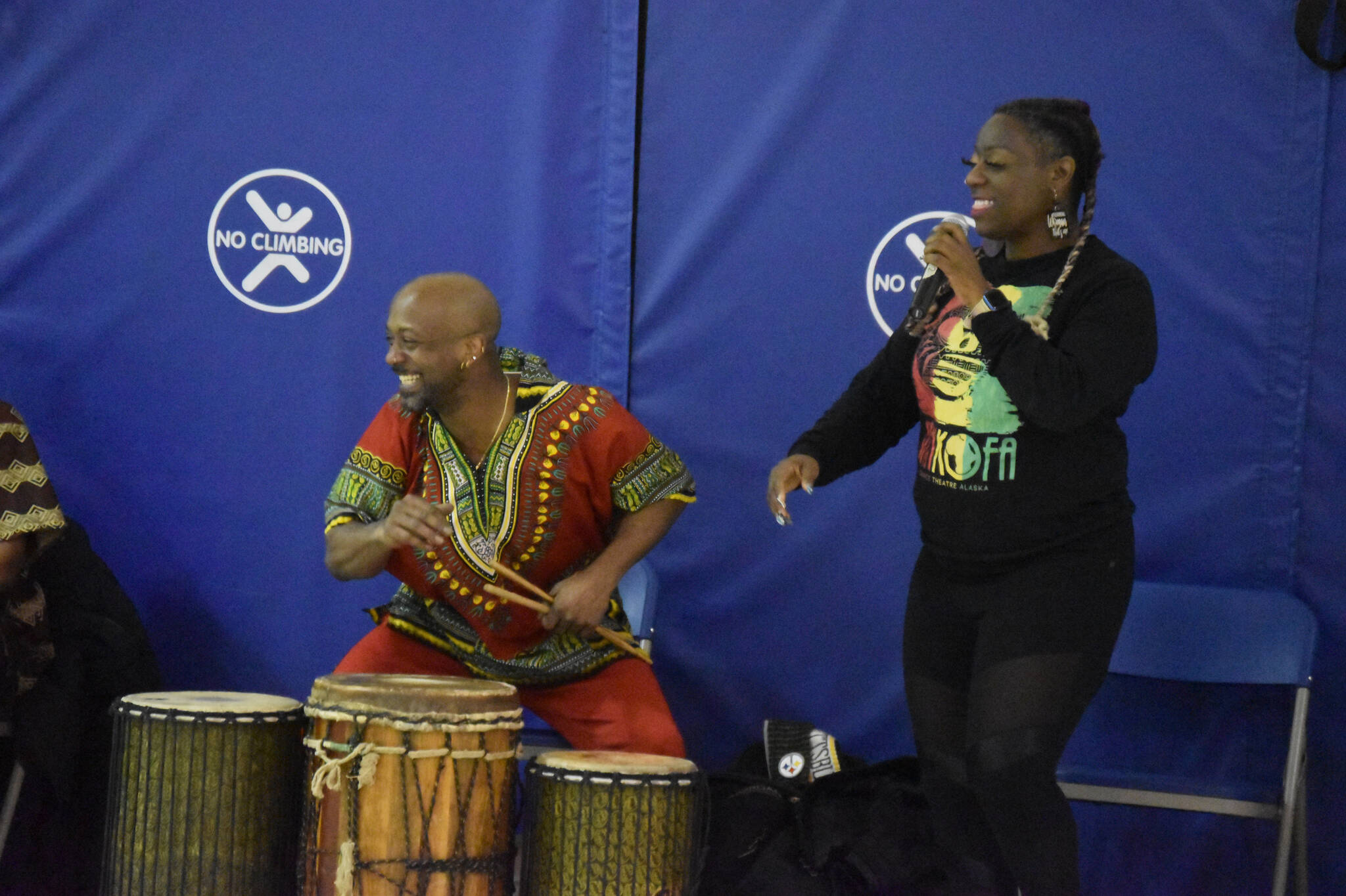 The members of Sankofa Dance Theater Alaska perform for a crowd of students during an opening performance at Kaleidoscope School of Arts and Science in Kenai, Alaska on Monday, March 20, 2023. (Jake Dye/Peninsula Clarion)