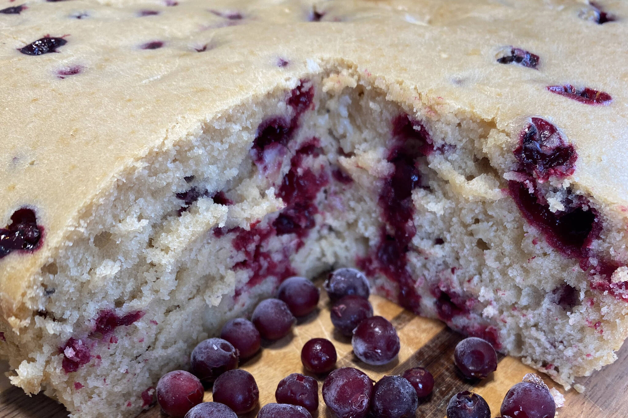 White chocolate cranberry cake is served with fresh cranberries. (Photo by Tressa Dale/Peninsula Clarion)