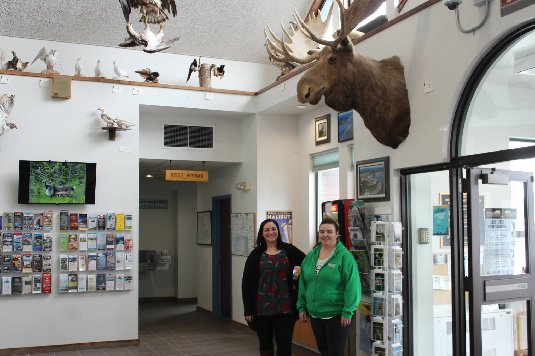 Samantha Springer, left, and Michelle Walker stand in the lobby of the Kenai Chamber of Commerce and Visitor Center on Wednesday, March 22, 2023, in Kenai, Alaska. (Ashlyn O’Hara/Peninsula Clarion)