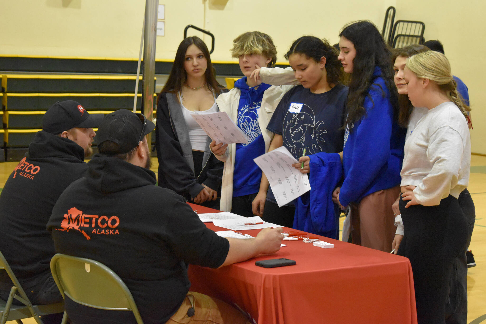 Cole Peterson, of METCO Alaska, talks to a group of students at Seward High School’s Career Day on Thursday, March 23, 2023, at Seward High School in Seward, Alaska. (Jake Dye/Peninsula Clarion)