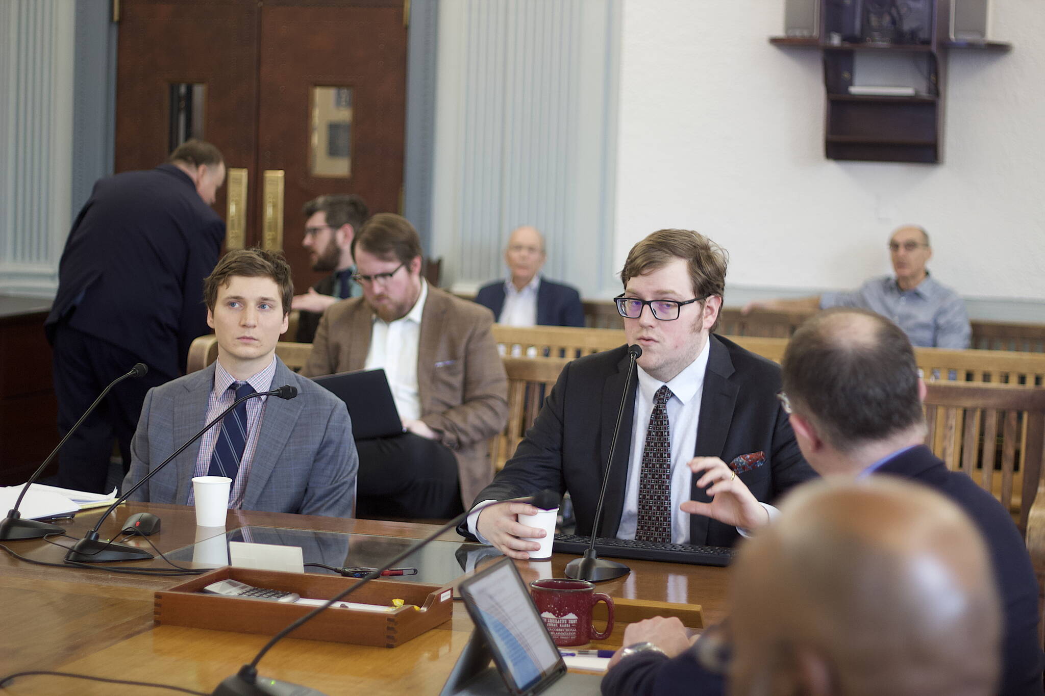 Mark Sabbatini / Juneau Empire
Legislative fiscal analysts Alexei Painter, right, and Conor Bell explain the state’s financial outlook during the next decade to the Senate Finance Committee on Friday.
