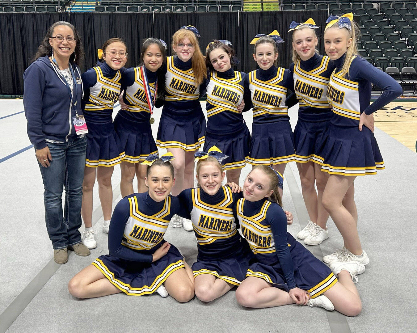 The Homer cheerleading squad. Front row, left to right: Thea James, Hannah Klima and Taylor Fraley. Back row, left to row: Head coach Winter Marshall-Allen, Tuong Thi Cat Tran, Sameah McGhee, Mari Brewer-Cote, Lynnzi Stout-Dee, Ellen Barrett, Ally High and Dorothea Hanenberger. Not pictured: Faith Latham, Nikole Drake and Angelynn Webb. (Photo provided)