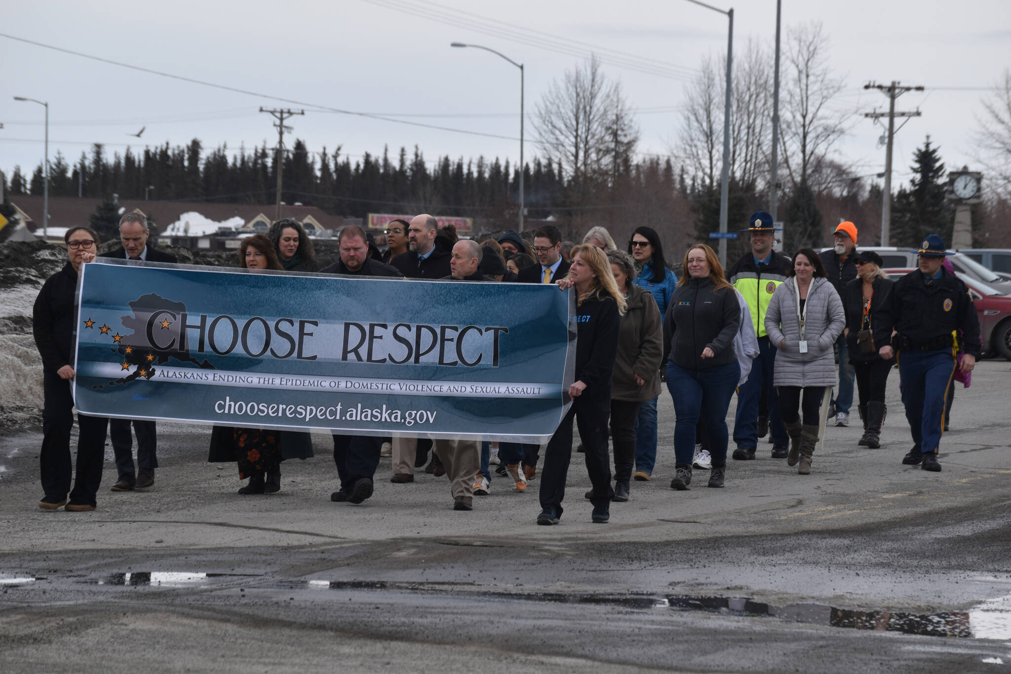 The 11th Annual Alaskans Choose Respect Awareness Event proceeds down Frontage Road in Kenai, Alaska on Wednesday, March 29, 2023. (Jake Dye/Peninsula Clarion)