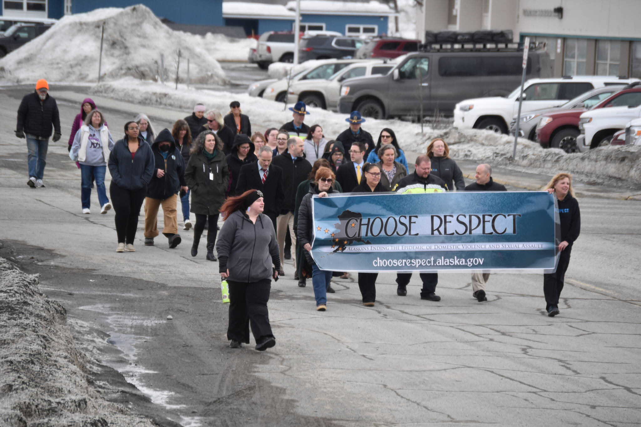The 11th Annual Alaskans Choose Respect Awareness Event proceeds down Frontage Road in Kenai, Alaska on Wednesday, March 29, 2023. (Jake Dye/Peninsula Clarion)