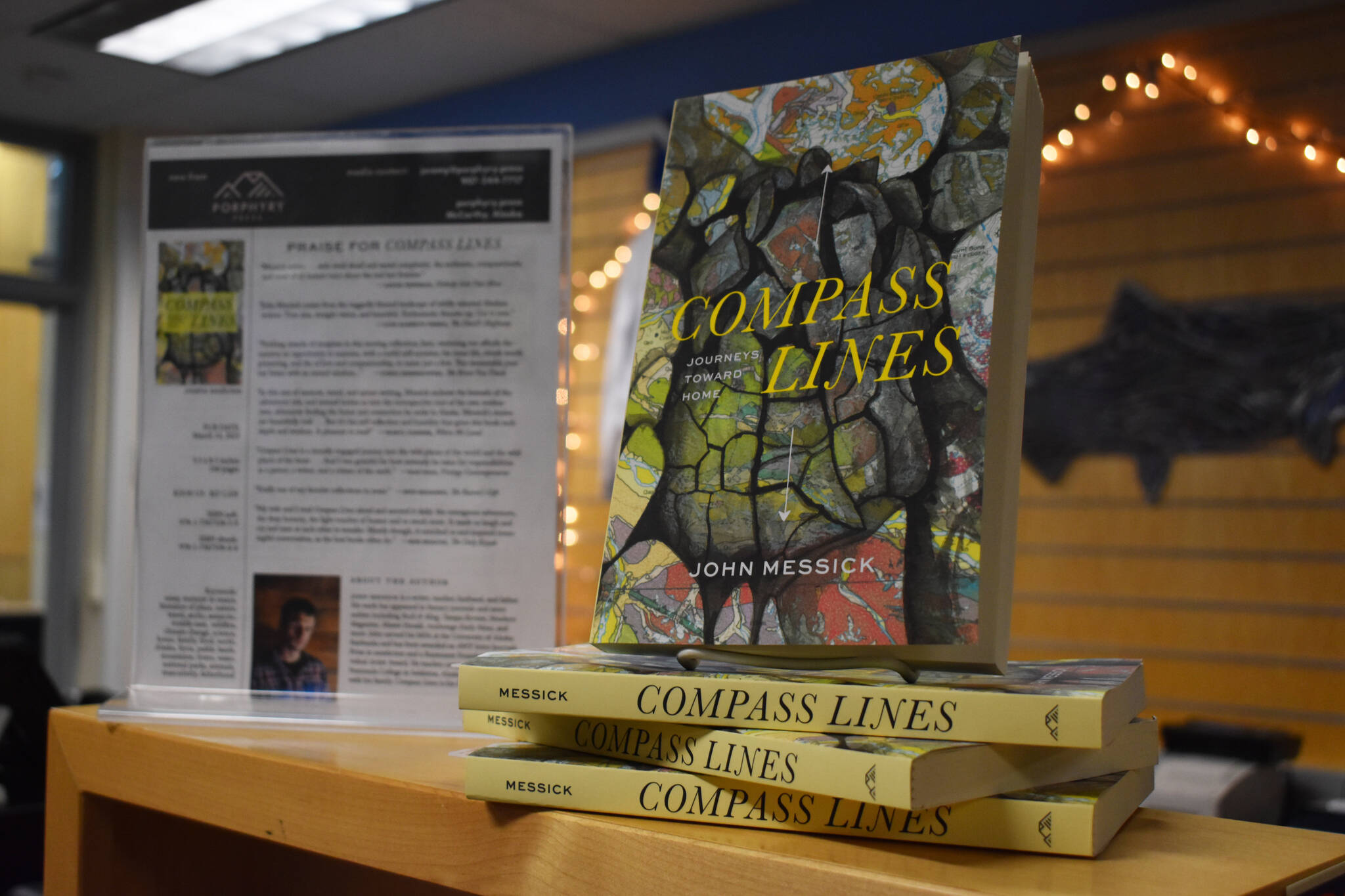 John Messick’s “Compass Lines” is displayed at the Kenai Peninsula College Bookstore in Soldotna, Alaska on Tuesday, March 28, 2023. (Jake Dye/Peninsula Clarion)