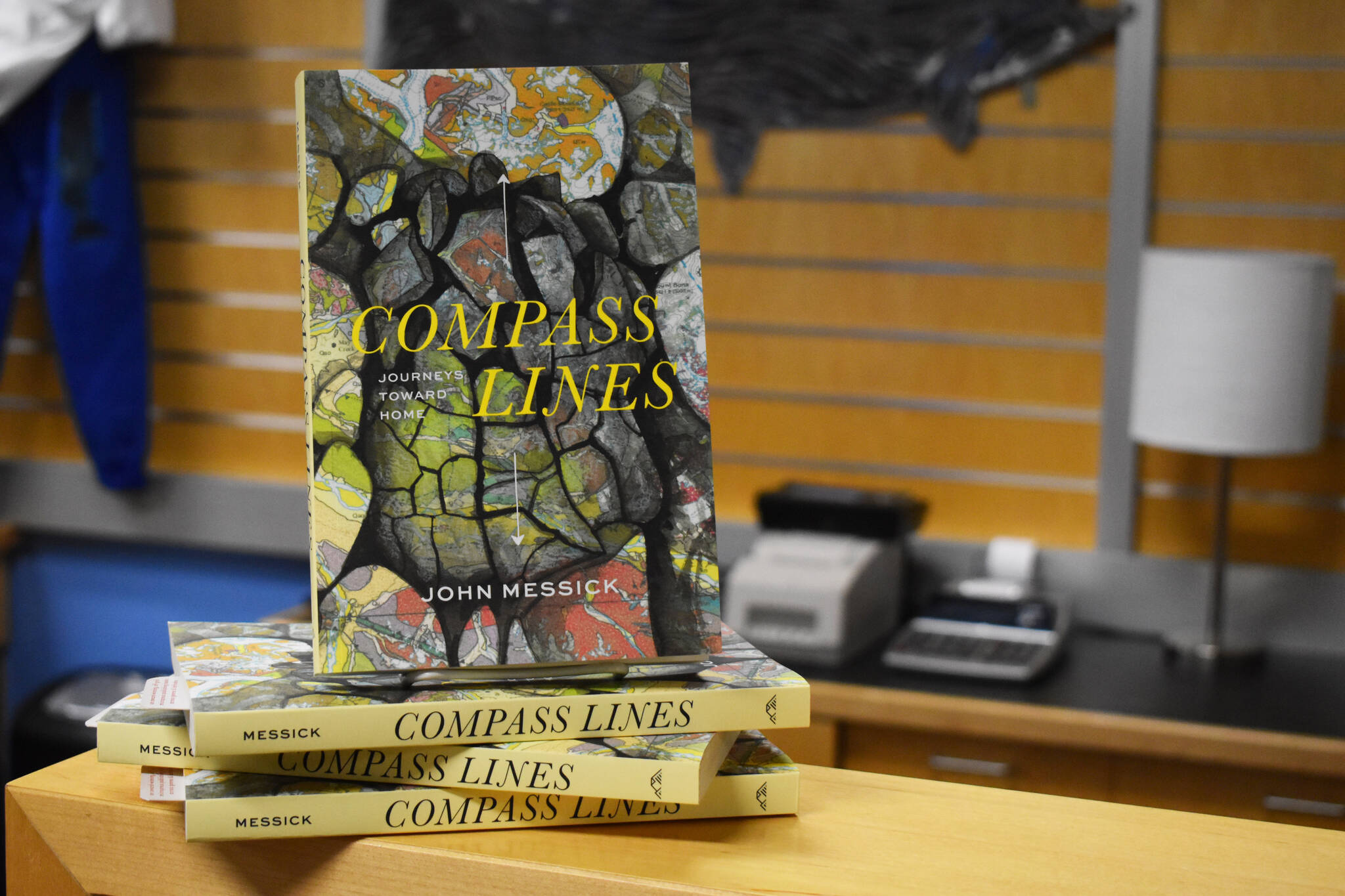 John Messick’s “Compass Lines” is displayed at the Kenai Peninsula College Bookstore in Soldotna, Alaska on Tuesday, March 28, 2023. (Jake Dye/Peninsula Clarion)