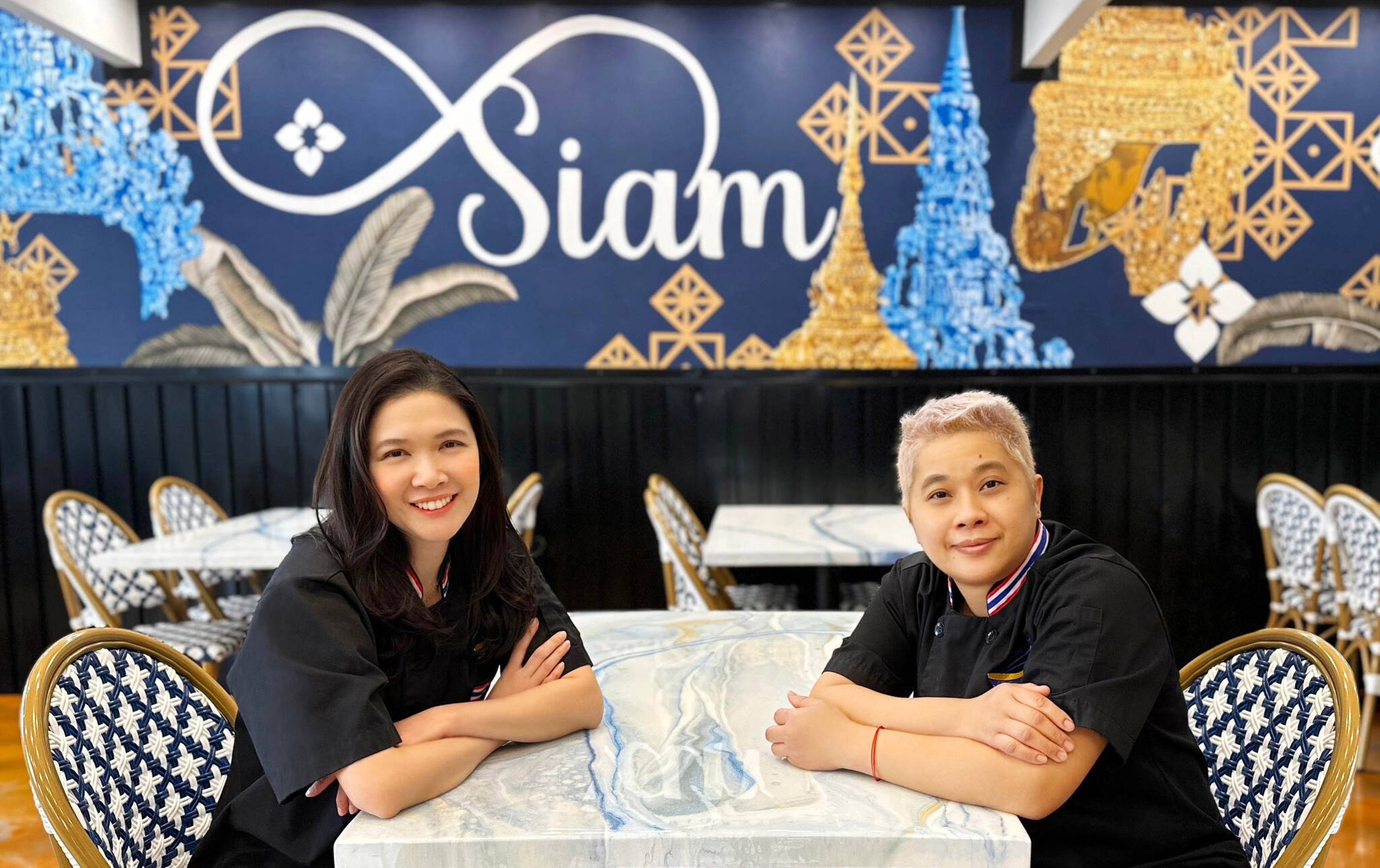 Owners Suwannasa Piwon and Phatcharin Apaipak sit for a photo at the new location of their Siam Noodles and Food in Soldotna, Alaska. (Photo provided by Siam Noodles and Food)