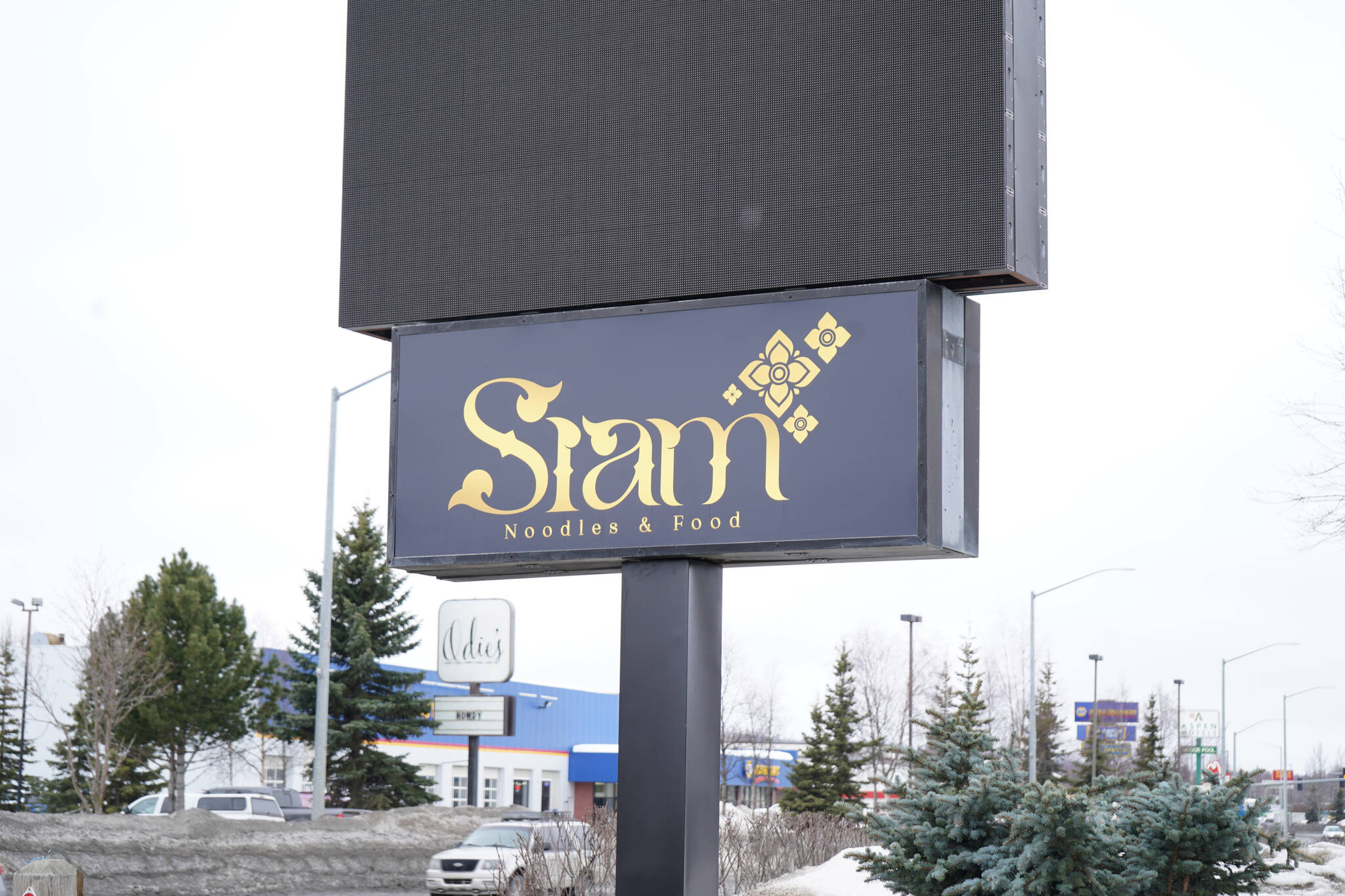 A sign for Siam Noodles and Food faces the Sterling Highway in Soldotna, Alaska, on Tuesday, March 28, 2023. (Jake Dye/Peninsula Clarion)