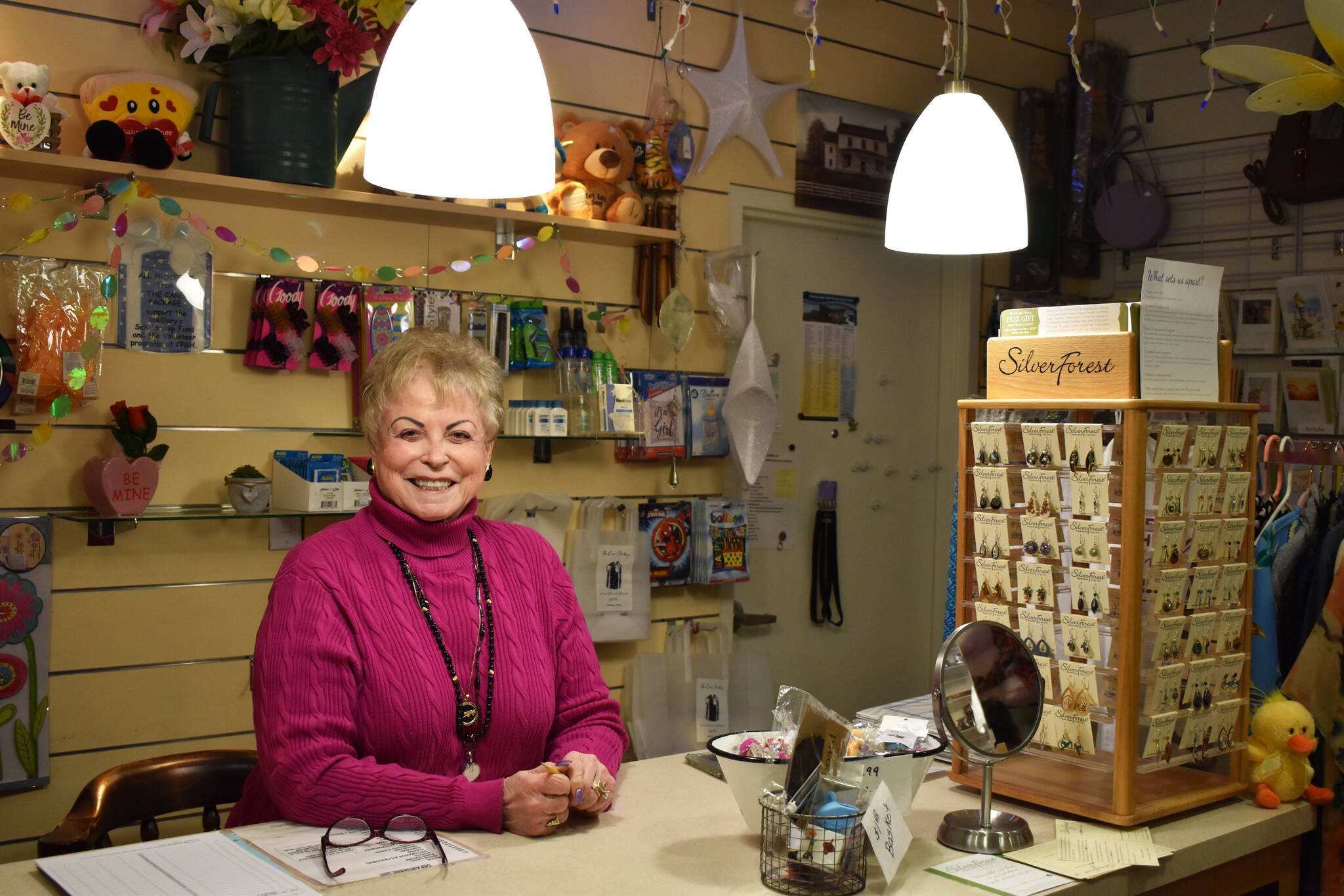 Donna Weeks volunteers at the Central Peninsula Hospital Gift Shop in Soldotna, Alaska, on Tuesday, April 11, 2023. (Jake Dye/Peninsula Clarion)