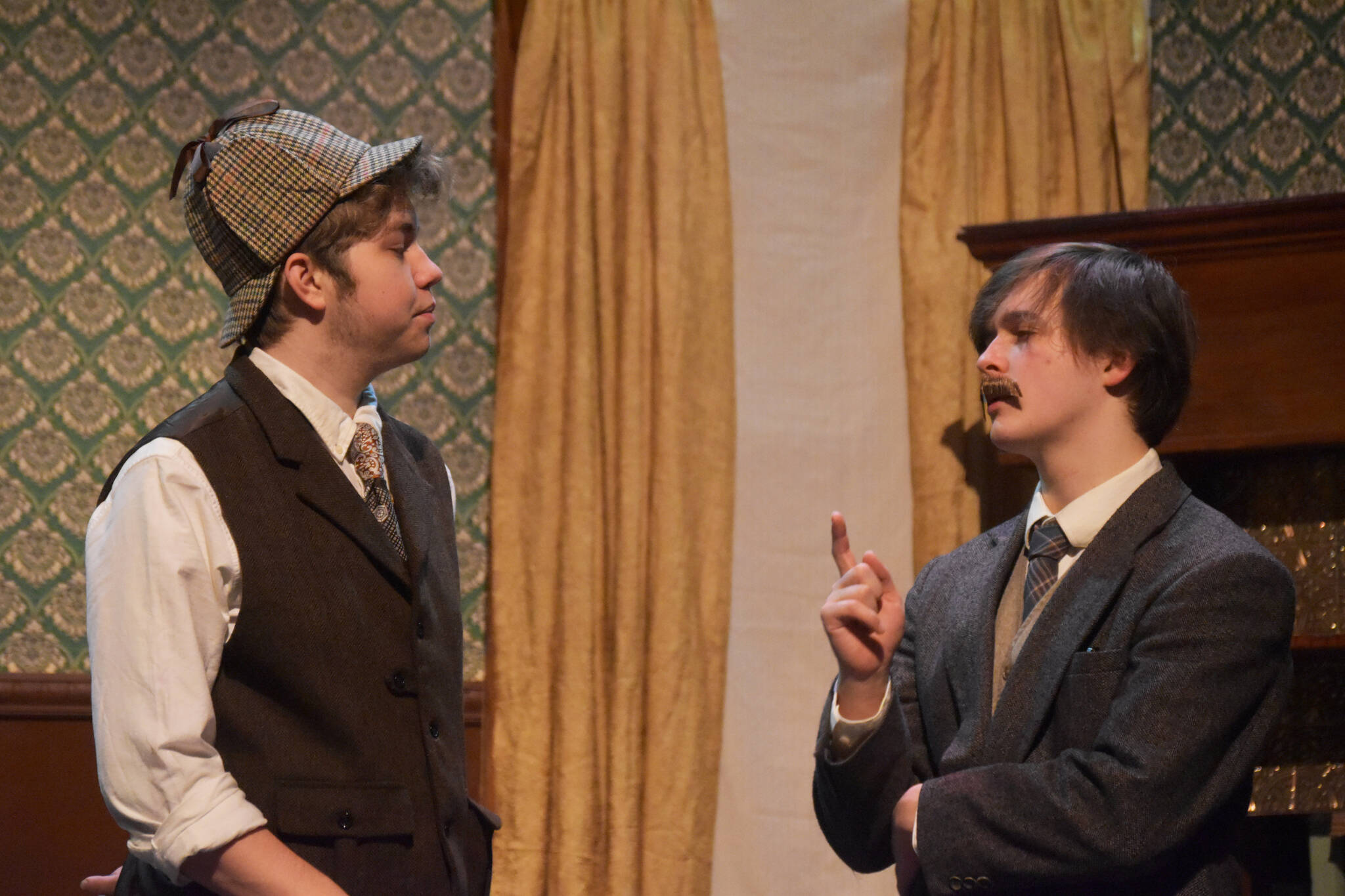 Josiah Burton as Sherlock Holmes and Darek Hatten as John Watson rehearse “Sherlock Holmes: The Final Adventure” at Soldotna High School in Soldotna, Alaska, on Wednesday, April 12, 2023. (Jake Dye/Peninsula Clarion)