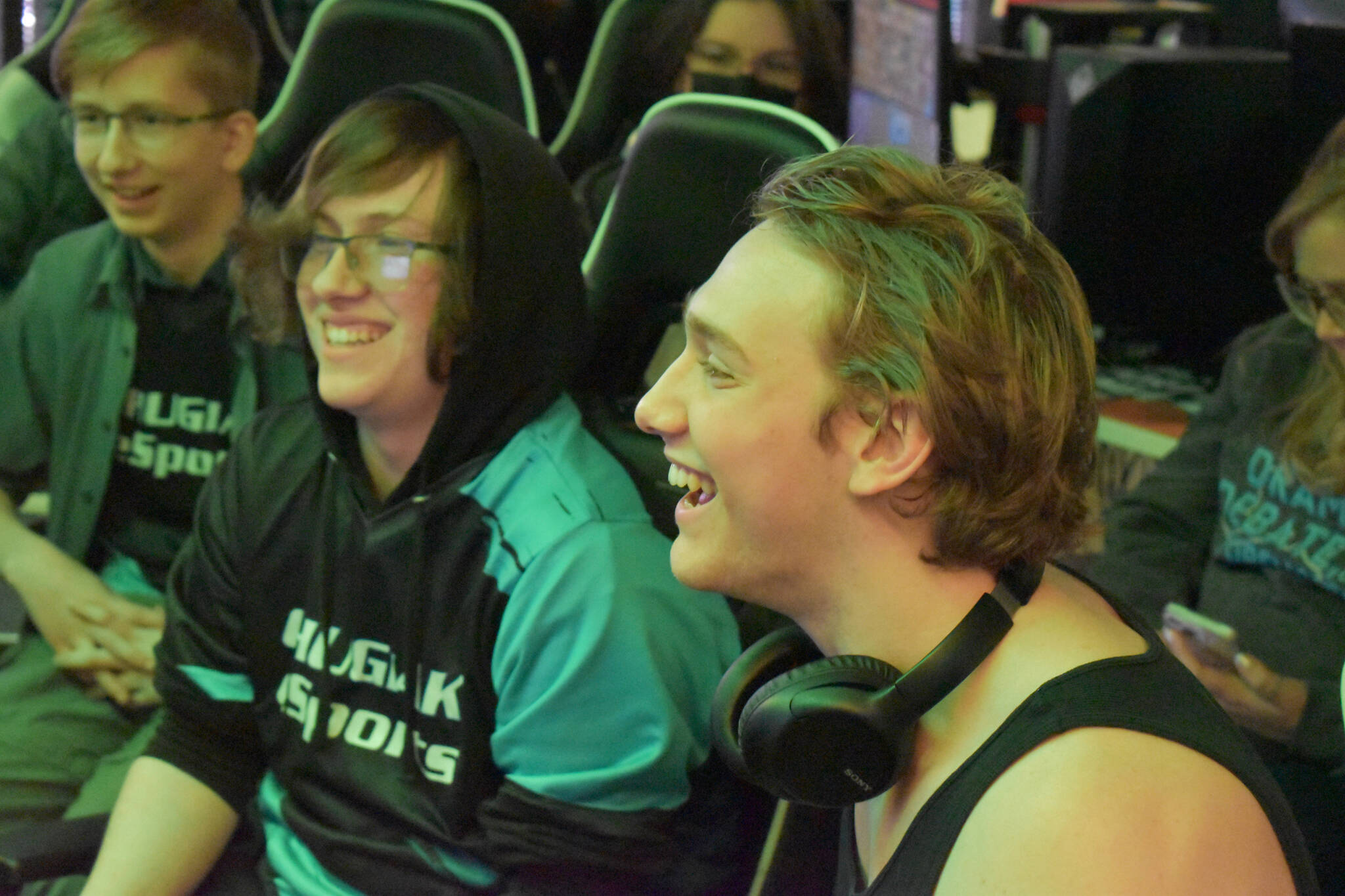 Chugiak’s Addison Rains and Kenai’s Kage Adkins laugh together while they compete in the final match of the Super Smash Bros. Ultimate State Championship on Saturday, April 22, 2023, at the University of Alaska Anchorage Esports Lounge in Anchorage, Alaska. (Jake Dye/Peninsula Clarion)