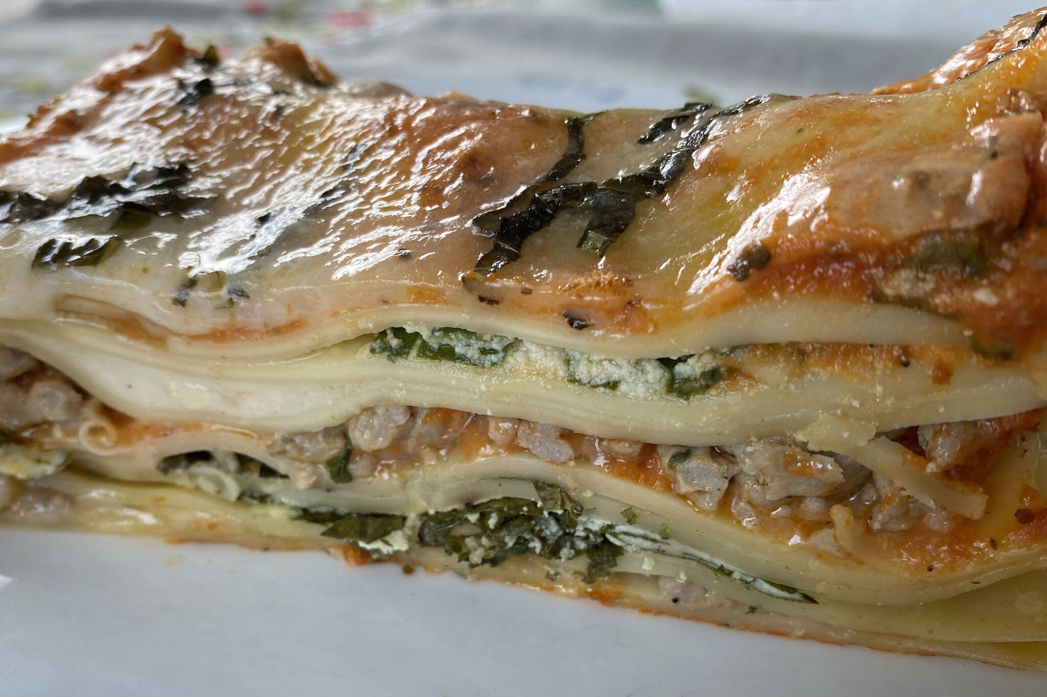This meat lasagna includes layers of sausage, ricotta, bechamel and spinach. (Photo by Tressa Dale/Peninsula Clarion)