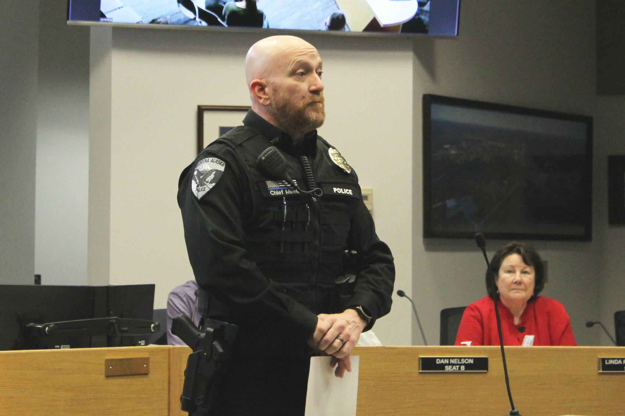 Soldotna Police Chief Gene Meek presents Officer David Bower with a Lifesaver Award during a Soldotna City Council meeting on Wednesday, April 26, 2023, in Soldotna, Alaska. (Ashlyn O’Hara/Peninsula Clarion)