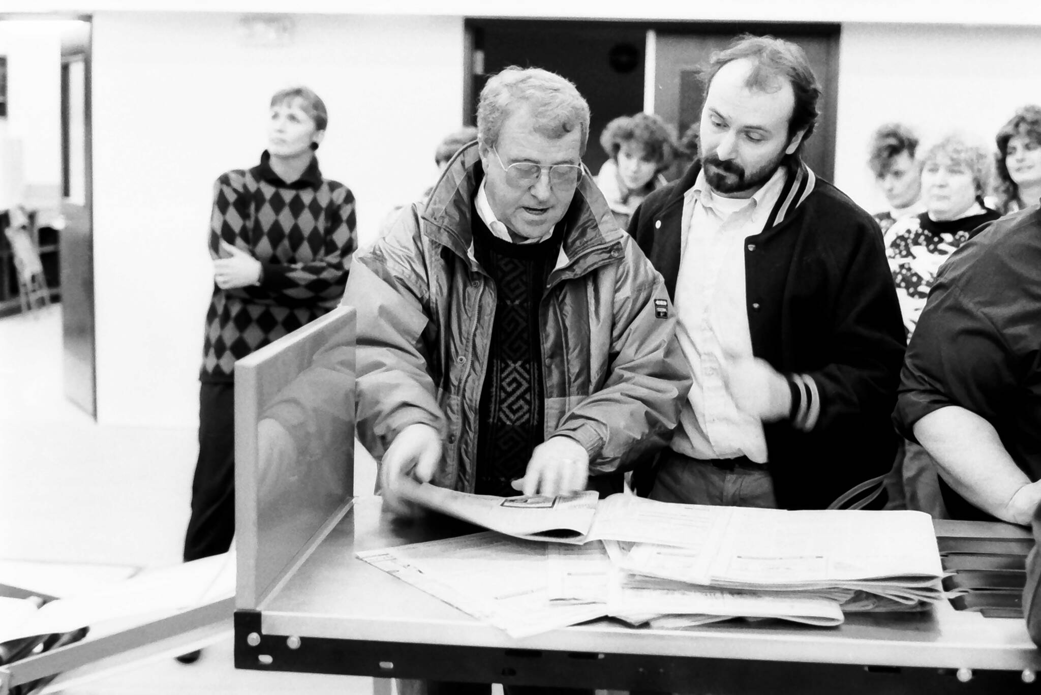 Peninsula Clarion Publisher Ronnie Hughes and Assistant Managing Editor Jon Little look over one of the first newspapers to come off the Goss Suburban press in December 1992 in the Peninsula Clarion pressroom in Kenai, Alaska. (Roy Shapeley/Peninsula Clarion)