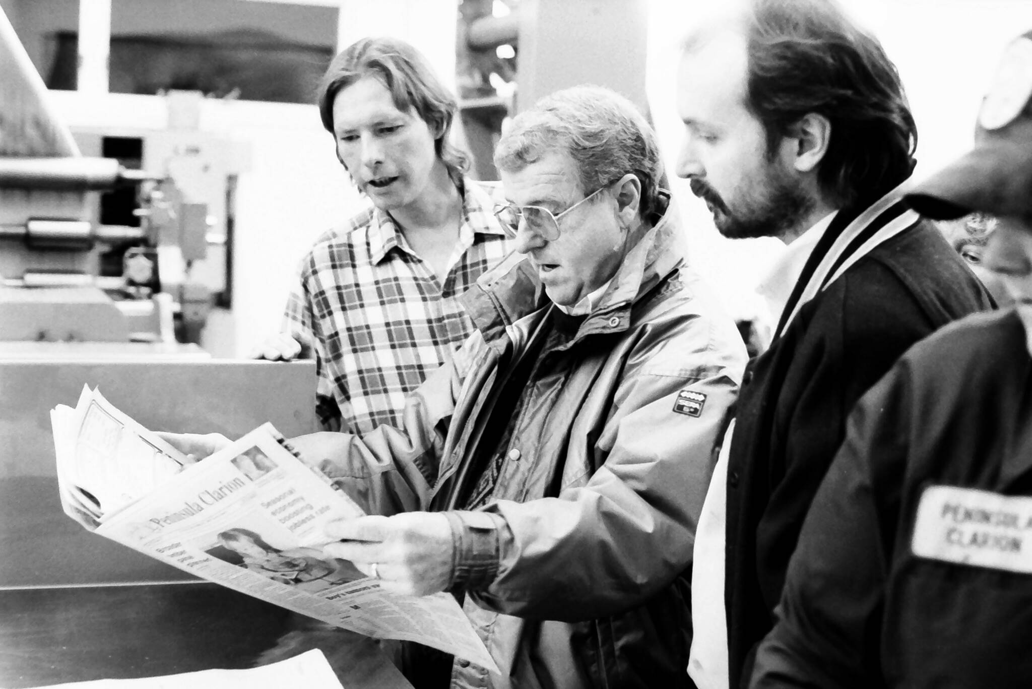 Roy Shapley /  Peninsula Clarion
Dick Westmoreland, Ronnie Hughes and Jon Little look over one of the first newspapers to come off the Clarion’s Goss Suburban in December 1992 in the Peninsula Clarion pressroom in Kenai.