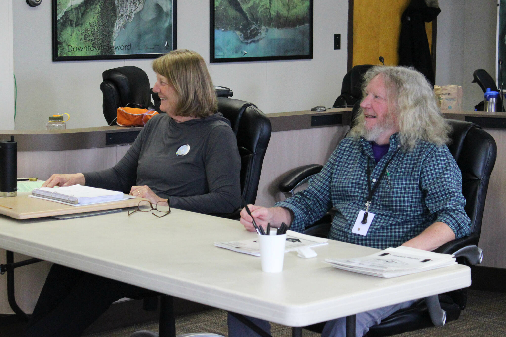 Poll workers Patricia Linville (left) and Mark Kansteiner (right) prepare to assist voters in Seward’s special election on Tuesday, May 2, 2023, in Seward, Alaska. (Ashlyn O’Hara/Peninsula Clarion)