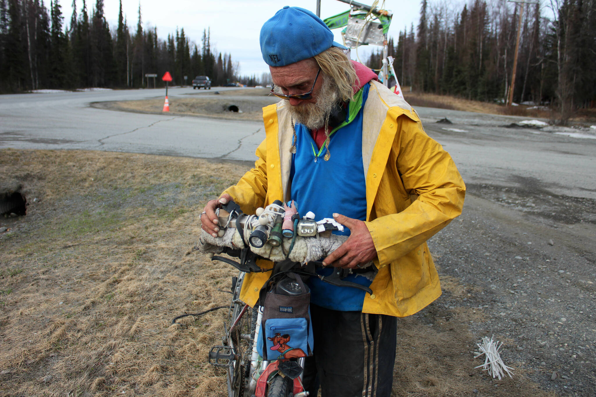 “White Rainbow” explains the lighting on his bike at a gas station on Wednesday, May 3, 2023 near Sterling, Alaska. (Ashlyn O’Hara/Peninsula Clarion)