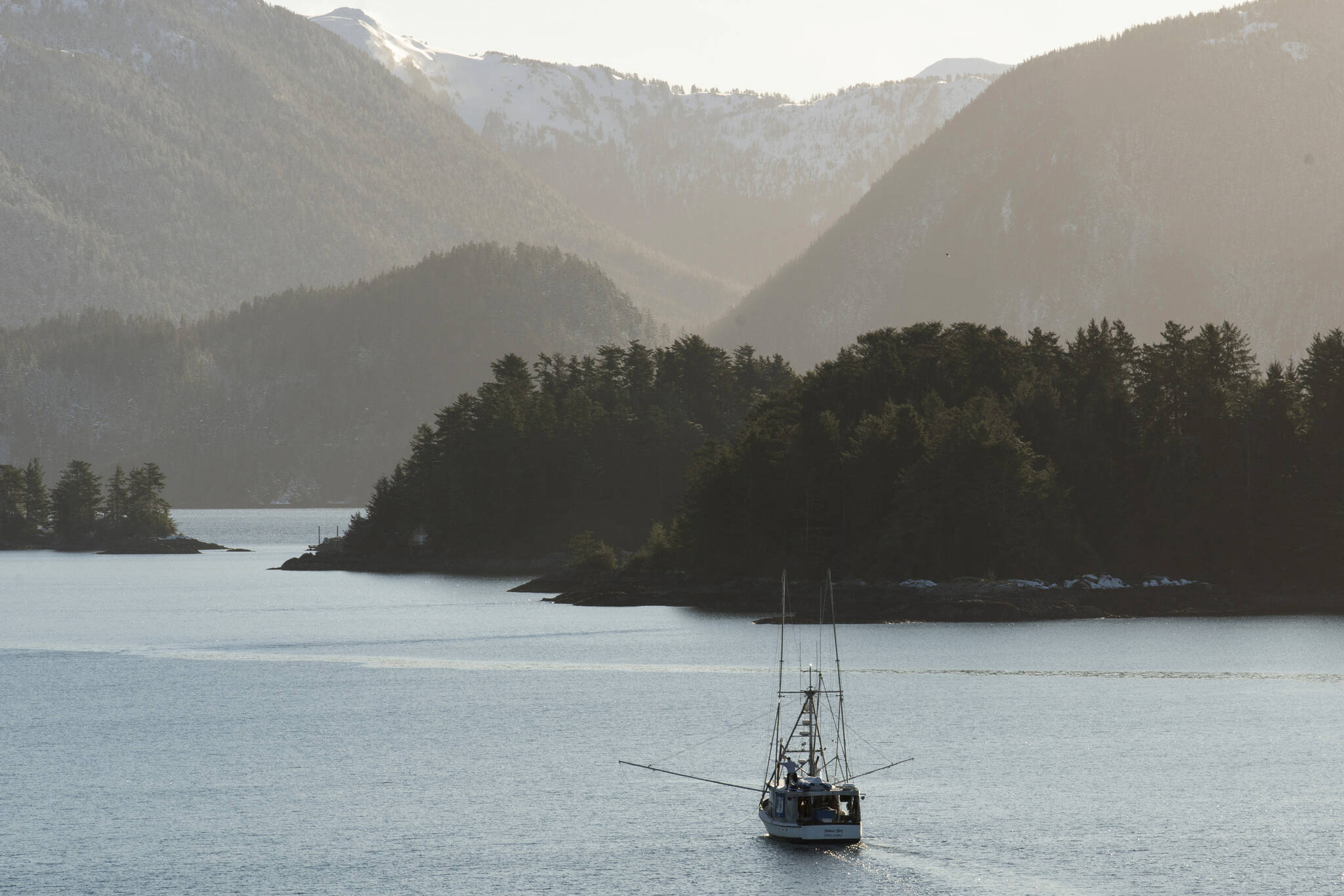 A troller fishes in Sitka Sound, Alaska on February 2, 2021. A ruling from a U.S. judge in Seattle could effectively shut down commercial king salmon trolling in Southeast Alaska — a valuable industry that supports some 1,500 fishermen — after a conservation group challenged the harvest as a threat to protected fish and the endangered killer whales that eat them. (James Poulson/Daily Sitka Sentinel via AP)