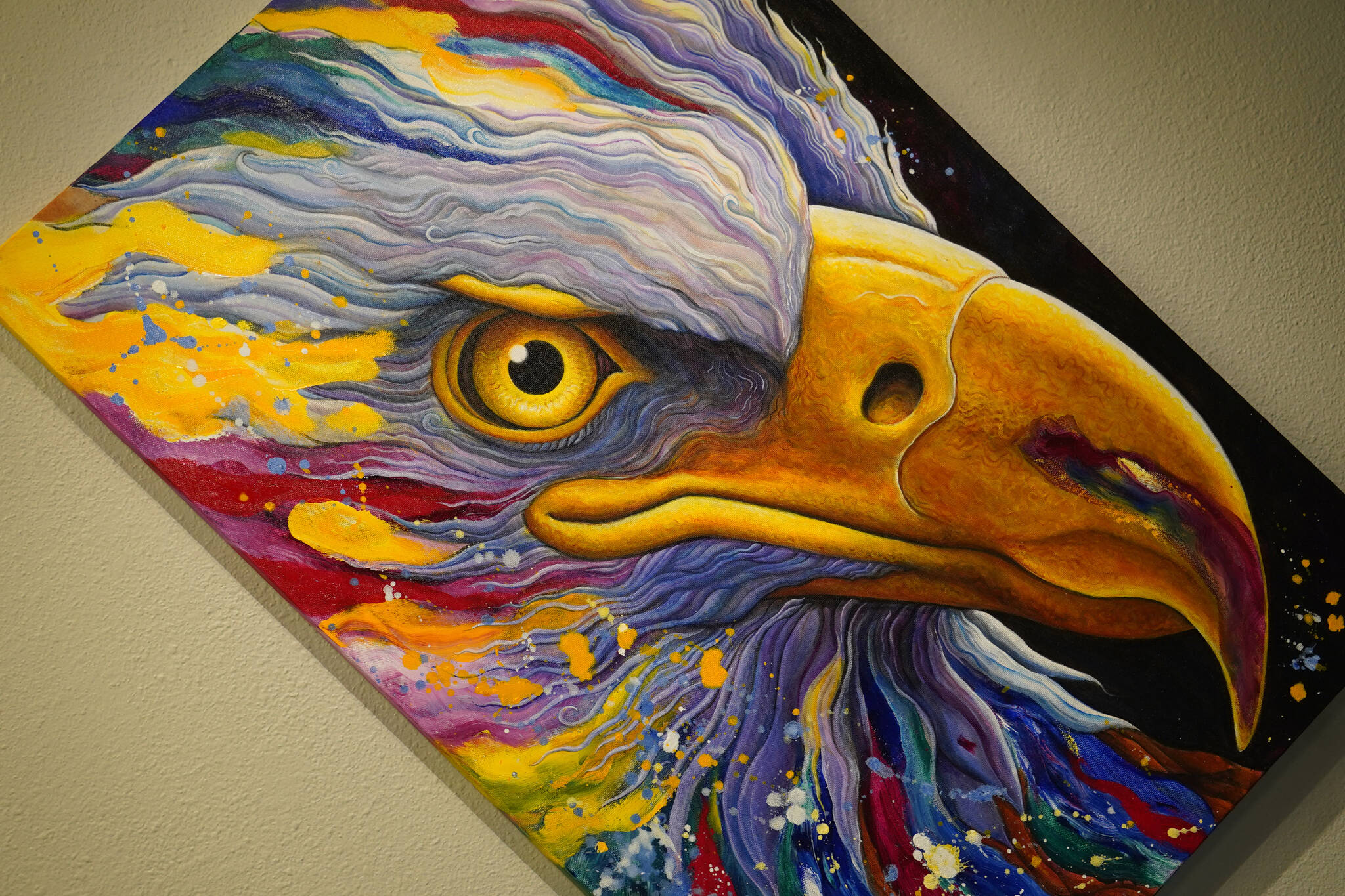 A vibrant painting of an eagle by artist Nathan Perry hangs as part of “Elaborate Expressions” at the Kenai Art Center in Kenai, Alaska on May 3, 2023. (Jake Dye/Peninsula Clarion)