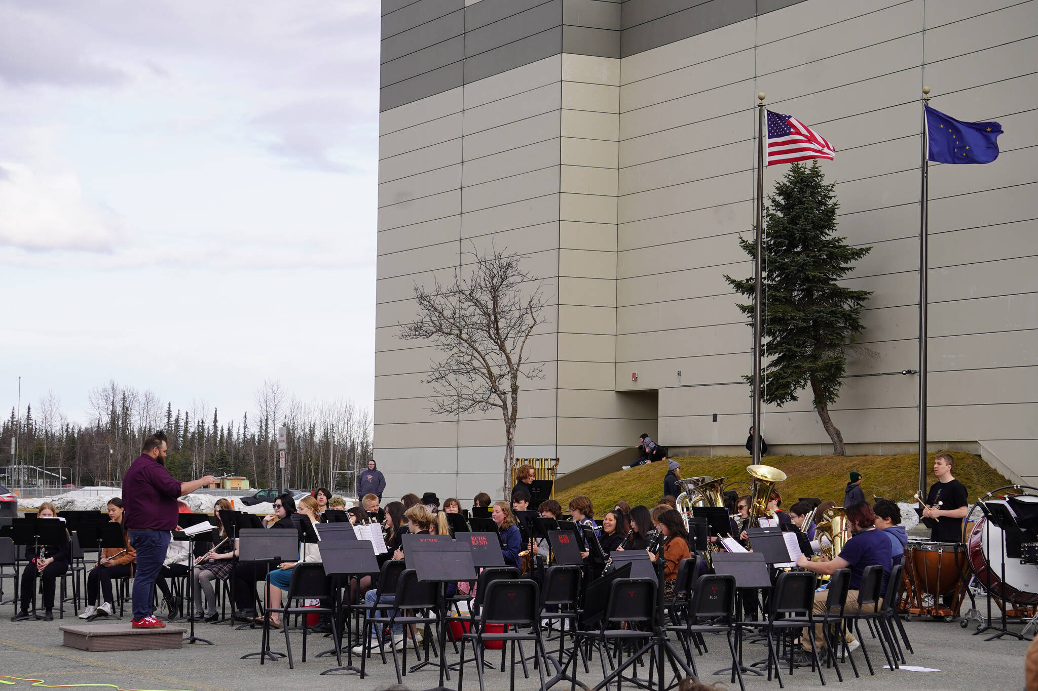 The Kenai Central High School Concert Band performs during Pops in the Parking Lot at Kenai Central High School in Kenai, Alaska, on Thursday, May 4, 2023. (Jake Dye/Peninsula Clarion)