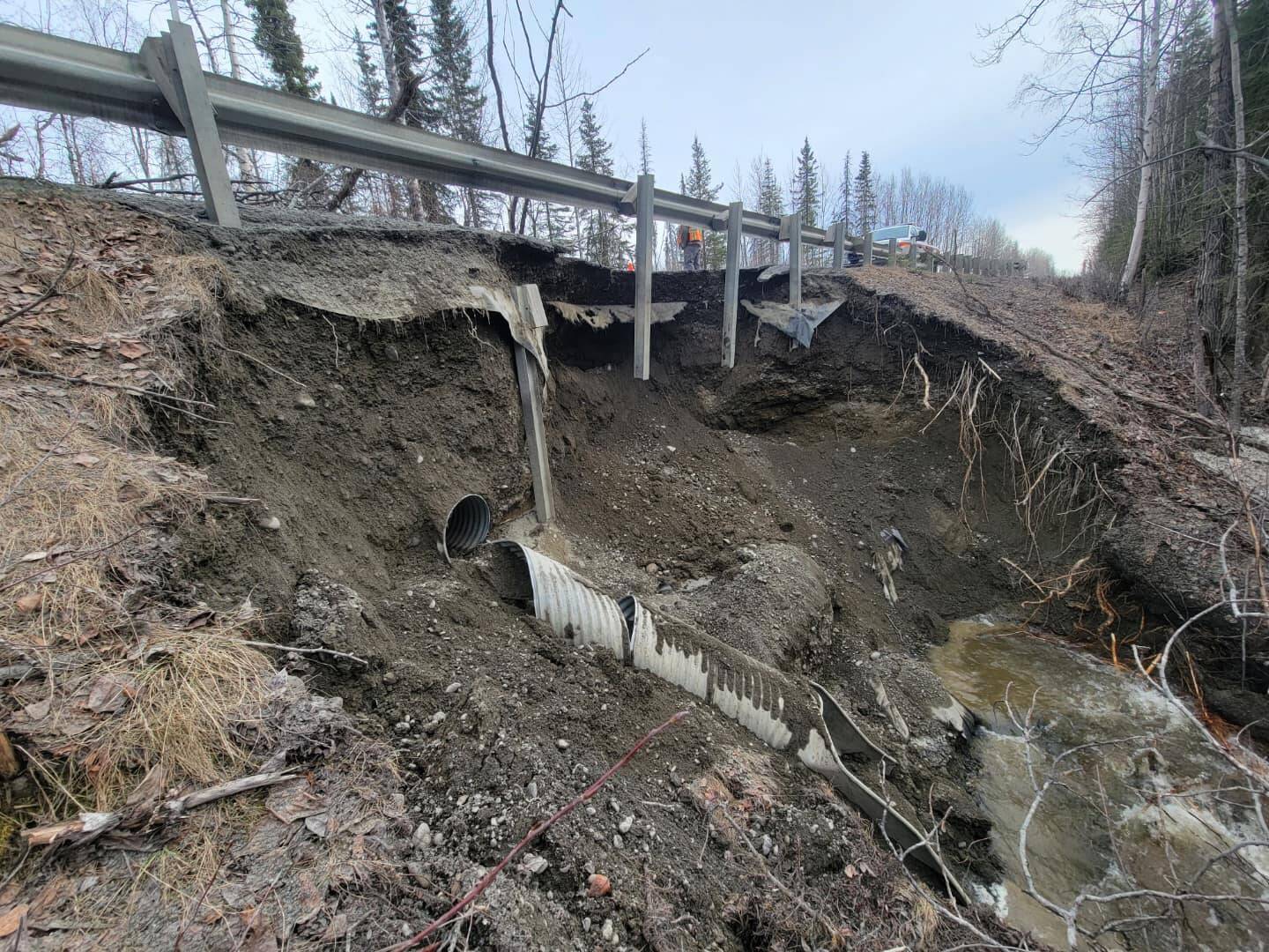A broken culvert is twisted beneath Funny River Road on Friday, May 5, 2023, near Soldotna, Alaska. (Photo via Kenai Peninsula Borough Office of Emergency Management)