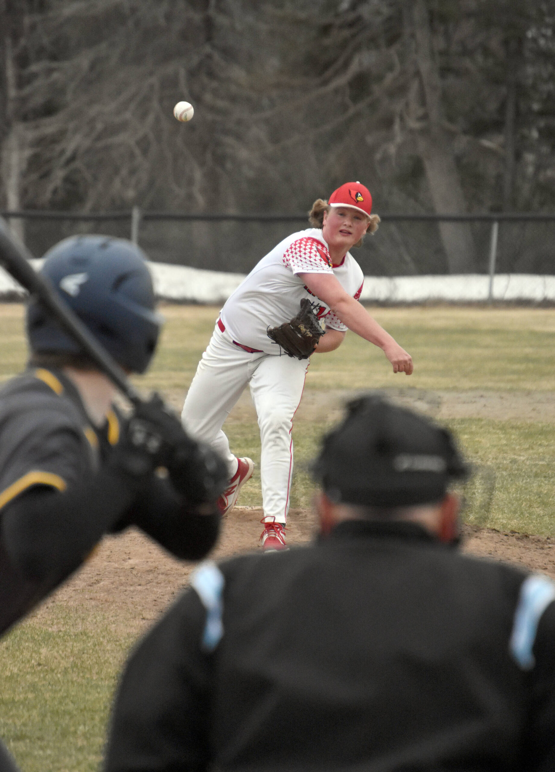 Kenai Central pitcher Charlie Chamberlain delivers to Homer on Monday, May 9, 2023, at the Kenai Little League fields in Kenai, Alaska. (Photo by Jeff Helminiak/Peninsula Clarion)