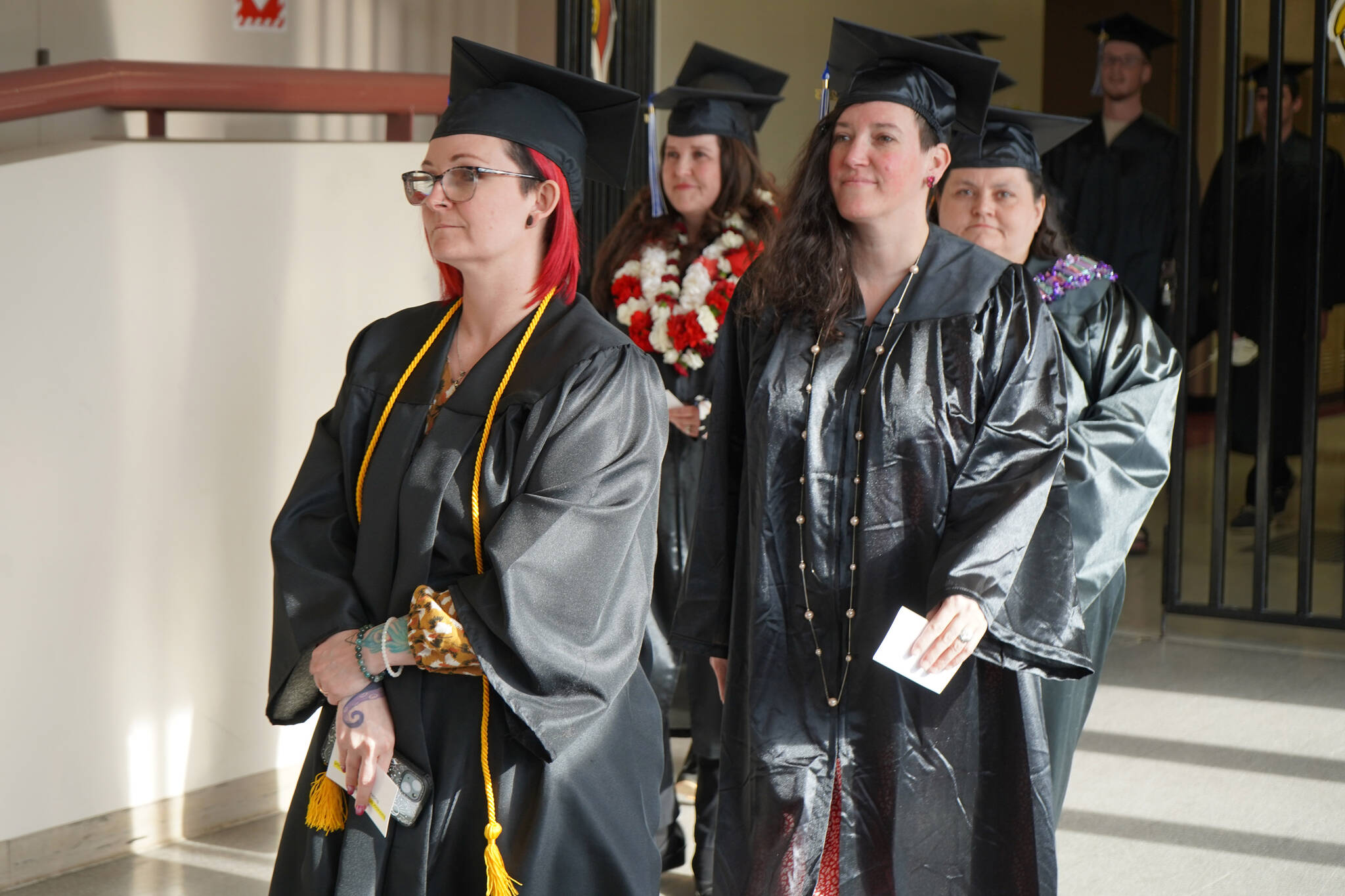 Kenai Peninsula College graduates proceed into the Renee C. Henderson Auditorium for Kenai Peninsula College’s 53rd annual commencement on Thursday, May 11, 2023, in Kenai, Alaska. (Jake Dye/Peninsula Clarion)