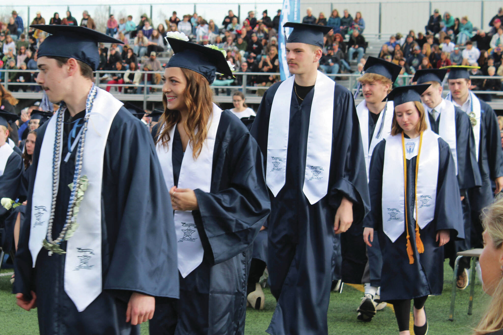 Soldotna High School graduates line up to receive diplomas during a ceremony on Monday. (Ashlyn O’Hara/Peninsula Clarion)