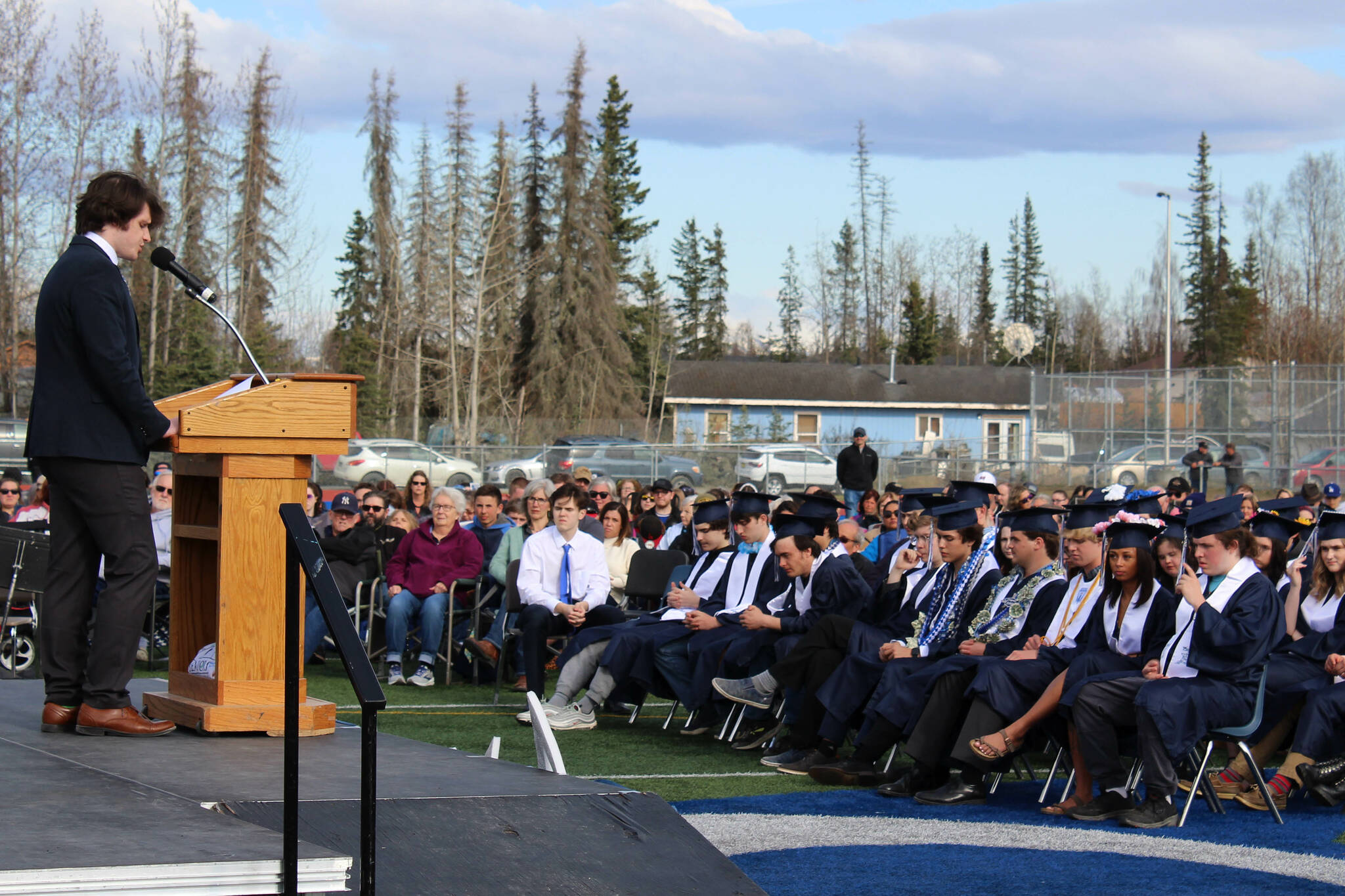 Soldotna High School U.S. Government teacher Luke Herman delivers the keynote address to Soldotna High School graduates during a ceremony on Monday, May 15, 2023, in Soldotna, Alaska. (Ashlyn O’Hara/Peninsula Clarion)