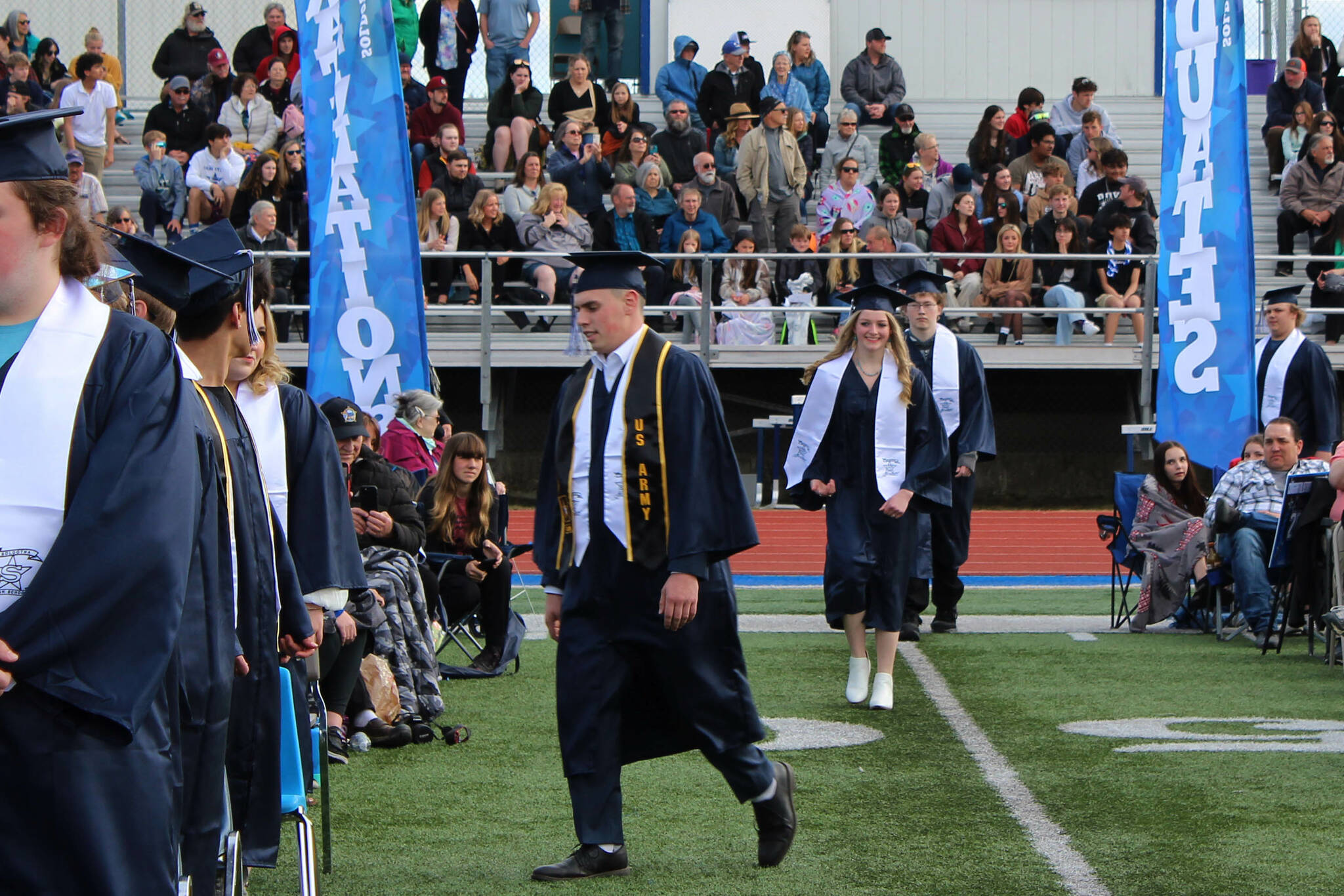 Graduates walk in to a ceremony at Soldotna High School on Monday, May 15, 2023, in Soldotna, Alaska. (Ashlyn O’Hara/Peninsula Clarion)