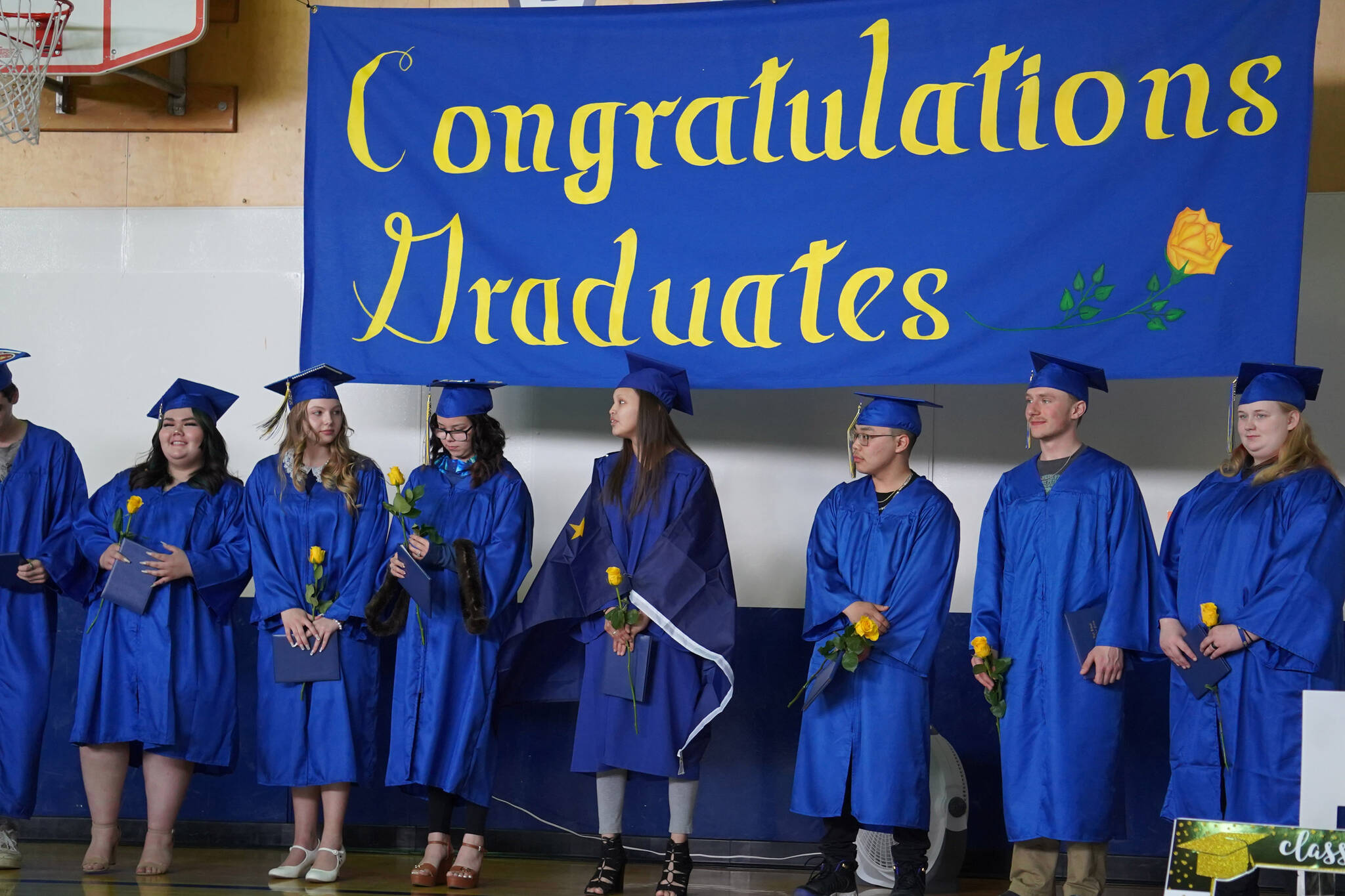 Kenai Alternative High School graduates celebrate receiving their diplomas during a graduation ceremony on Monday, May 15, 2023, at Kenai Alternative High School in Kenai, Alaska. (Jake Dye/Peninsula Clarion)