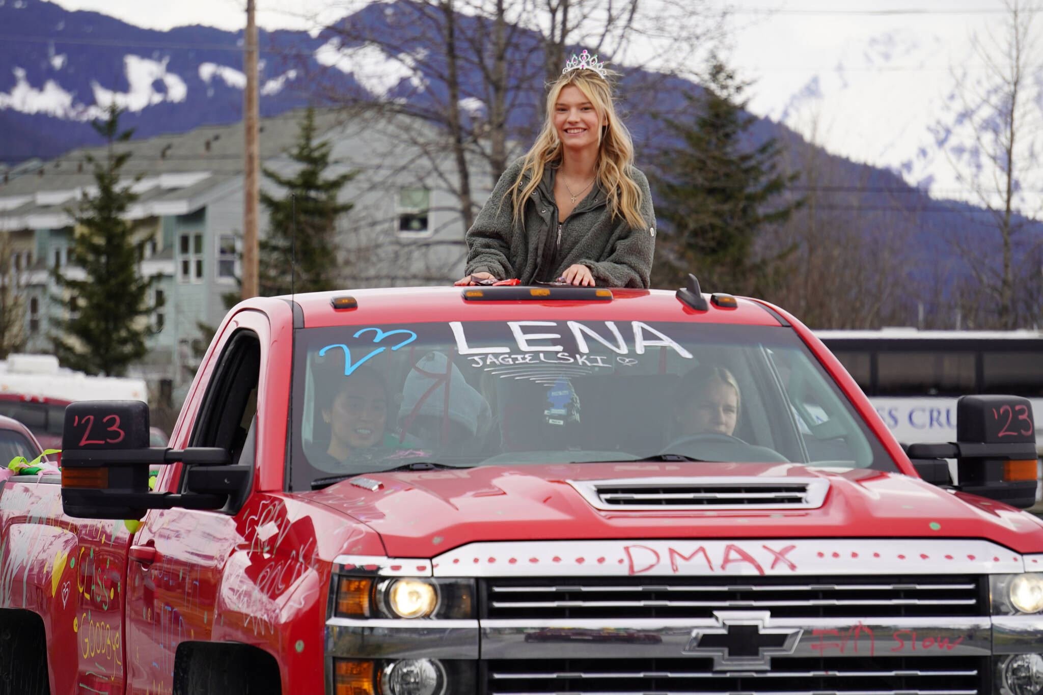 Seward graduate Lena Jagielski parades down 4th Avenue in Seward, Alaska on Friday, May 12, 2023. (Jake Dye/Peninsula Clarion)