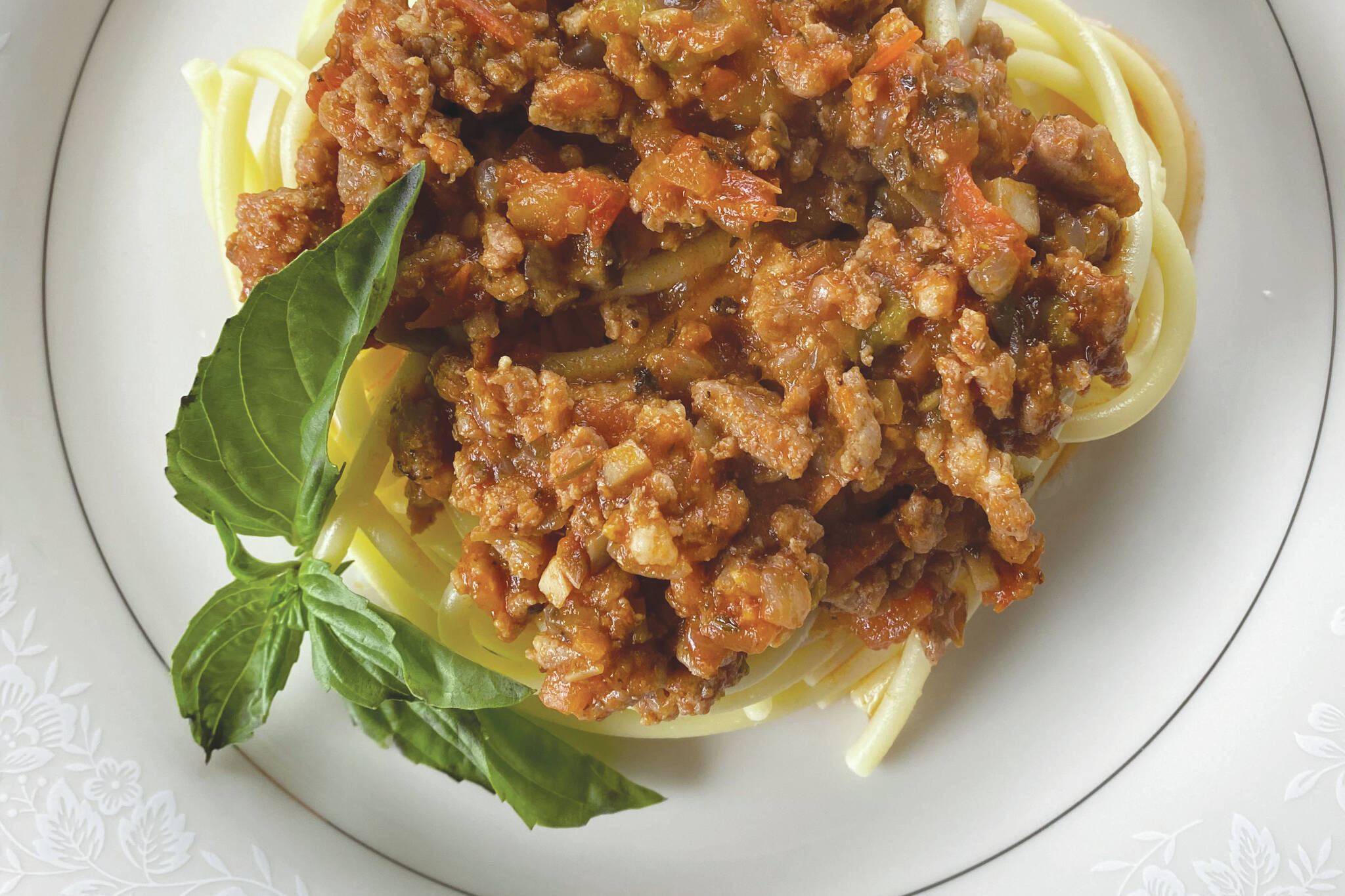 This meaty sauce is savory and herbaceous and is well worth the four hours of simmer time. (Photo by Tressa Dale/Peninsula Clarion)