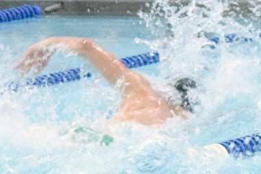 Colony's Jake Simmons and Kodiak's Talon Lindquist duke it out in the 50-yard freestyle before teammates Friday, Sept. 22, 2017, at the Soldotna Pentathlon at Soldotna High School. Lindquist won the race and the Pentathlon title. (Photo by Jeff Helminiak/Peninsula Clarion)