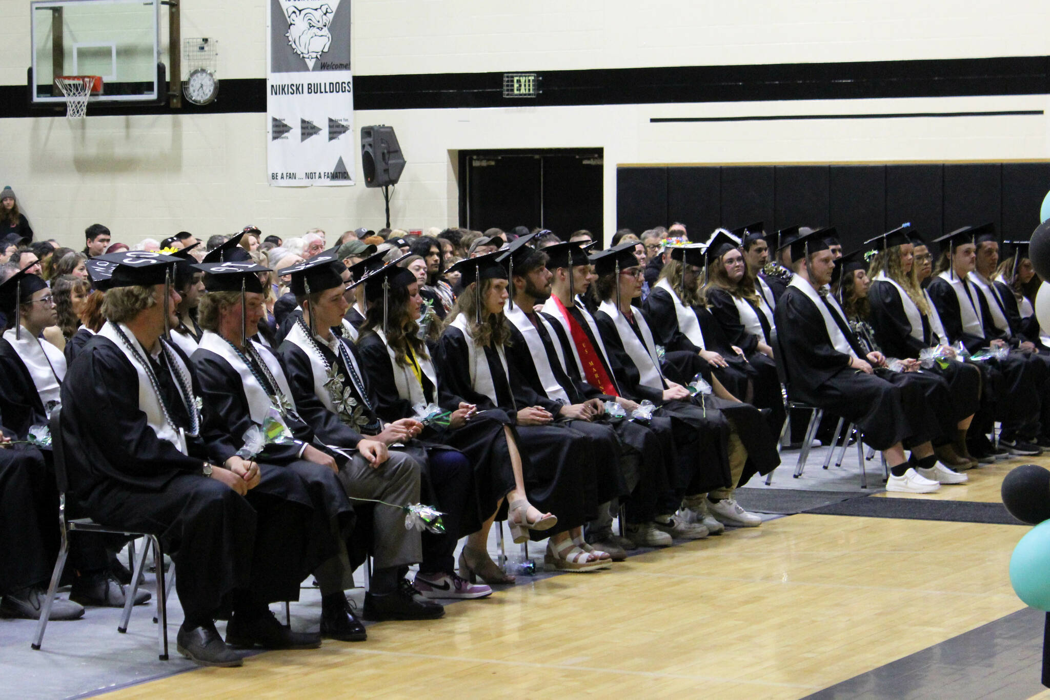 Nikiski Middle/High School graduates wait to receive diplomas at a ceremony on Tuesday, May 16, 2023 in Nikiski, Alaska. (Ashlyn O’Hara/Peninsula Clarion)