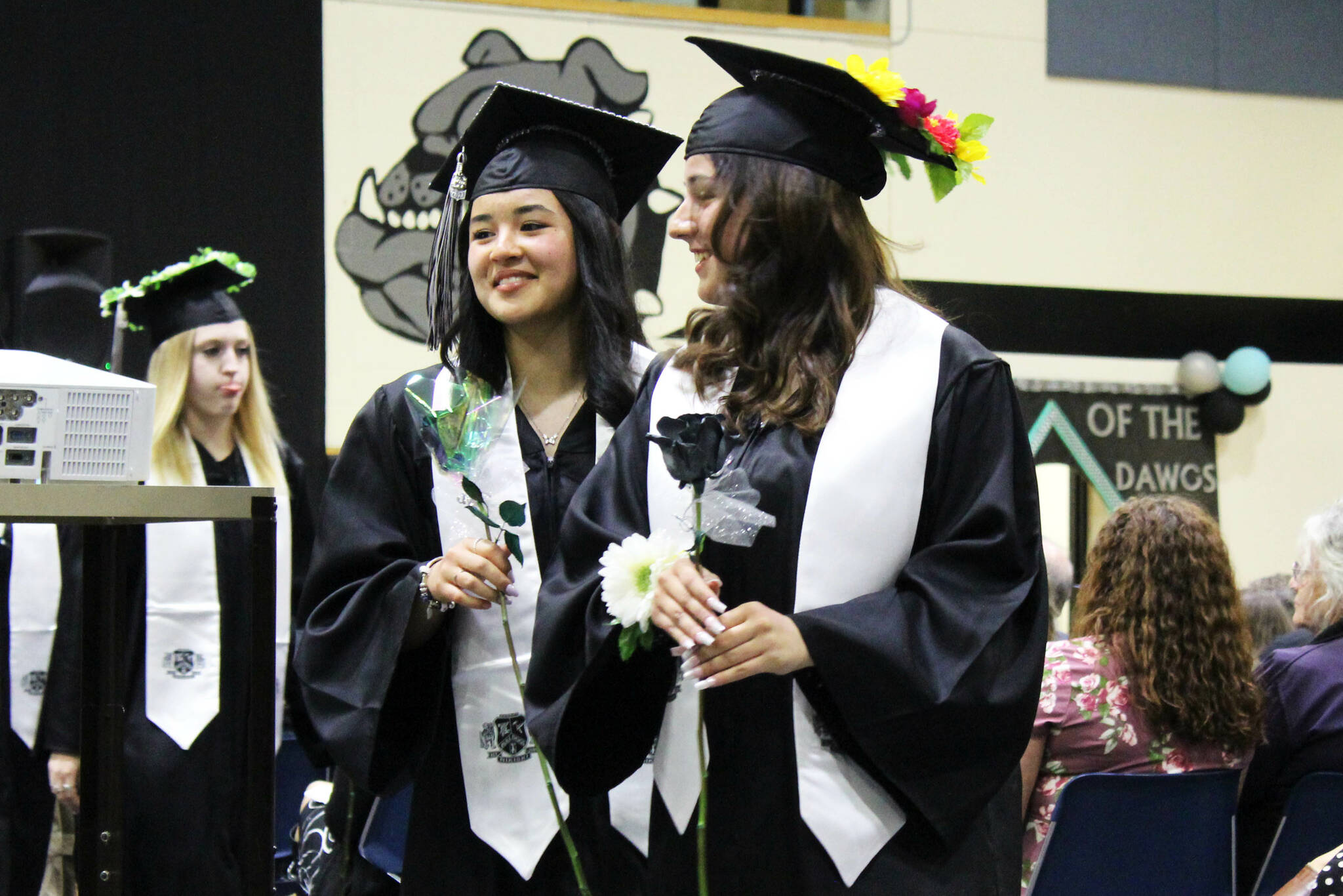 Nikiski Middle/High School graduates present roses to their loved ones during a ceremony on Tuesday, May 16, 2023 in Nikiski, Alaska. (Ashlyn O’Hara/Peninsula Clarion)