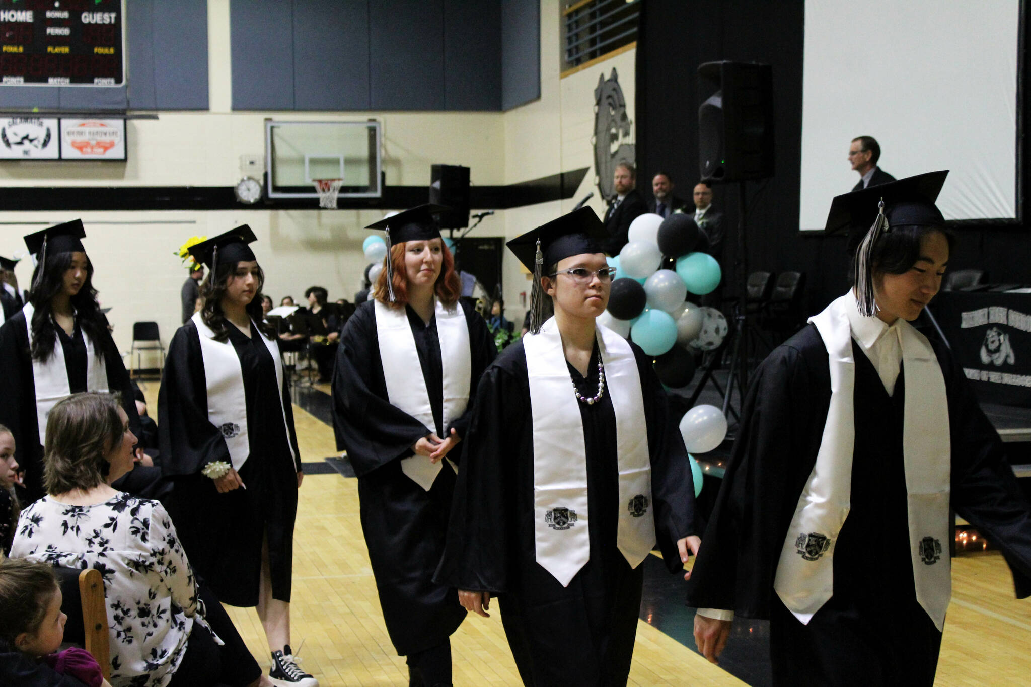 Nikiski Middle/High School graduates prepare to receive diplomas at a ceremony on Tuesday, May 16, 2023 in Nikiski, Alaska. (Ashlyn O’Hara/Peninsula Clarion)