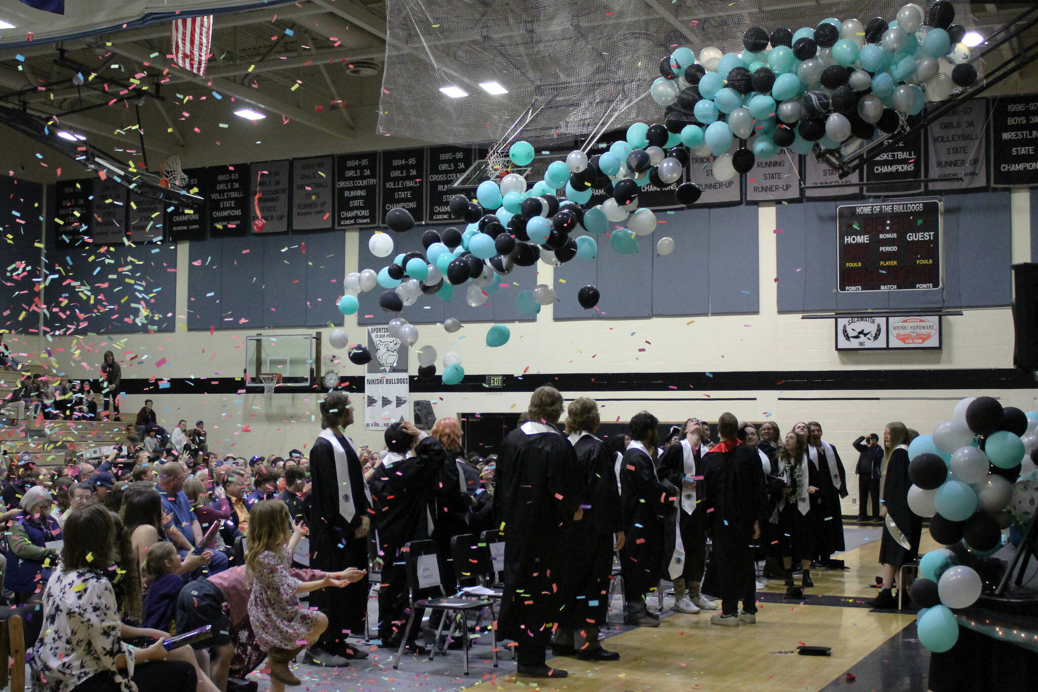 Balloons fall on Nikiski Middle/High School graduates on Tuesday, May 16, 2023, in Nikiski, Alaska. (Ashlyn O’Hara/Peninsula Clarion)