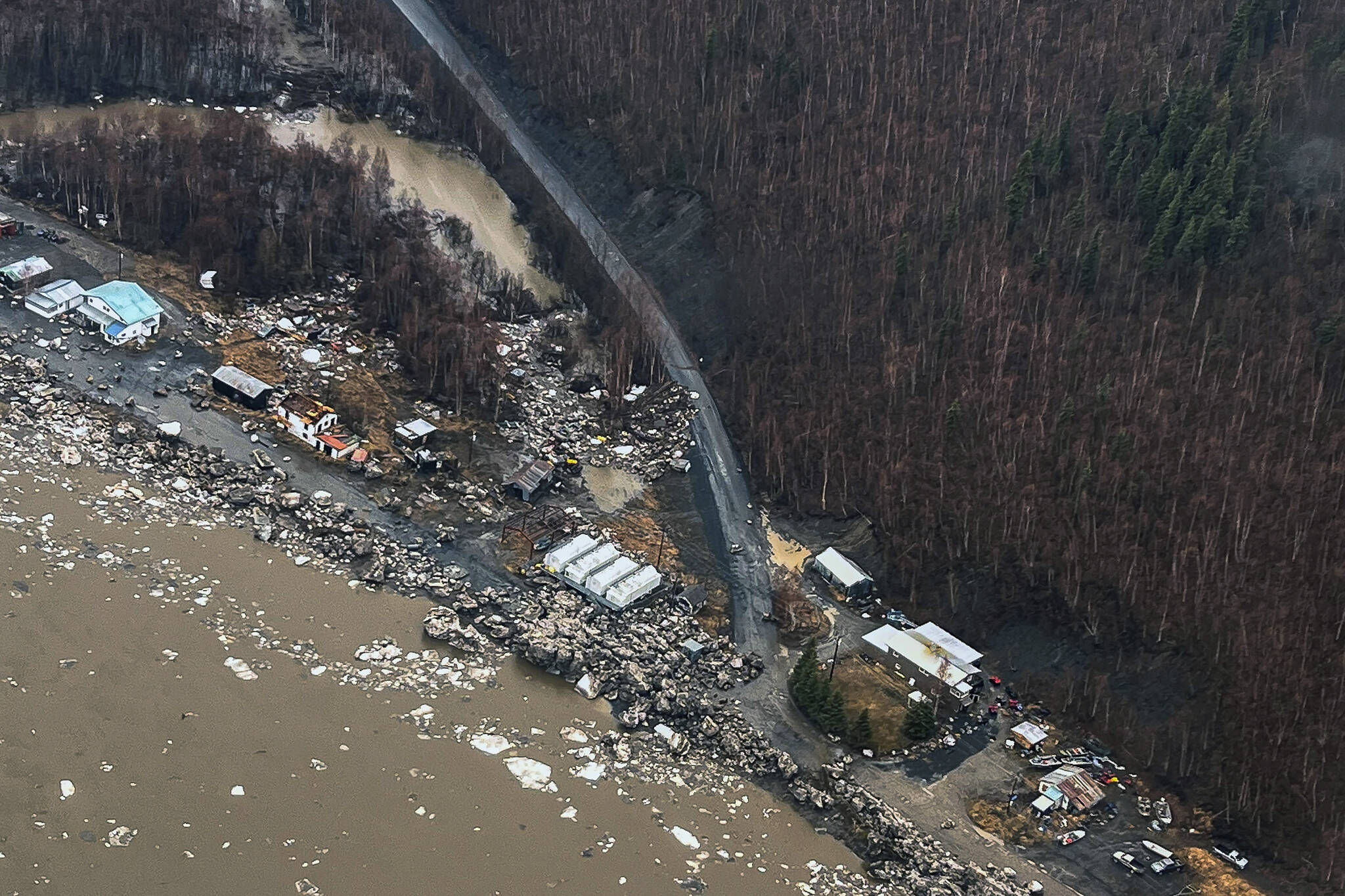 In this aerial photo chunks of ice follow flooding from an ice jam in Crooked Creek, Alaska, May 15, 2023. Ice jams along two Alaska rivers unleashed major flooding over the weekend. (Jennifer Wallace, Alaska Division of Homeland Security and Emergency Management via AP)