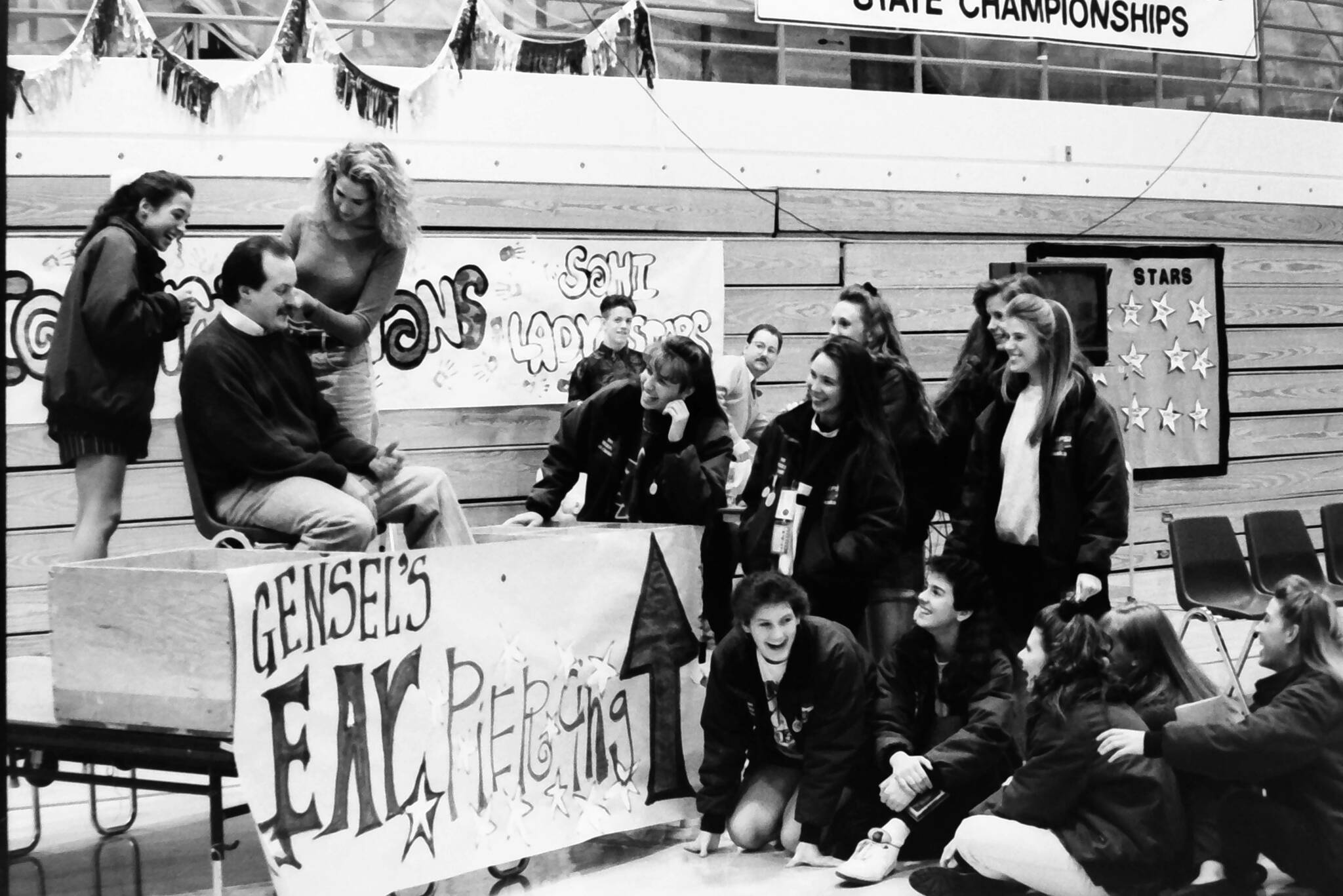 Coach Dan Gensel gets his ear pierced to celebrate Soldotna High School’s first team-sport state championship on Friday, Febr. 12, 1993 in Soldotna, Alaska. Gensel, who led the Soldotna High School girls basketball team to victory, had promised his team earlier in the season that he would get his ear pierced if they won the state title. (Rusty Swan/Peninsula Clarion)