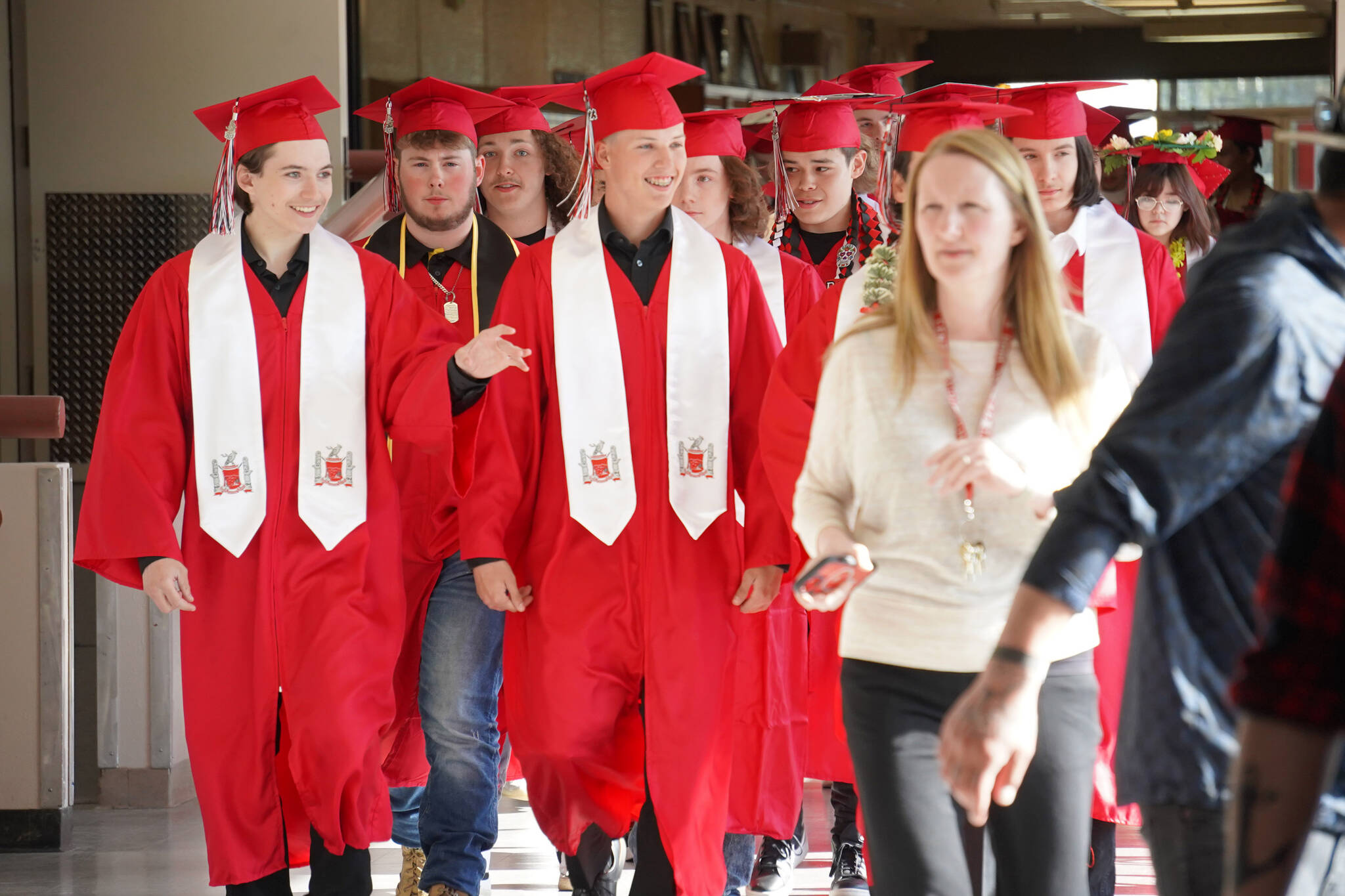Kenai Central High School graduates prepare to enter the auditorium for their graduation ceremony on Wednesday, May 17, 2023, at Kenai Central High School in Kenai, Alaska. (Jake Dye/Peninsula Clarion)