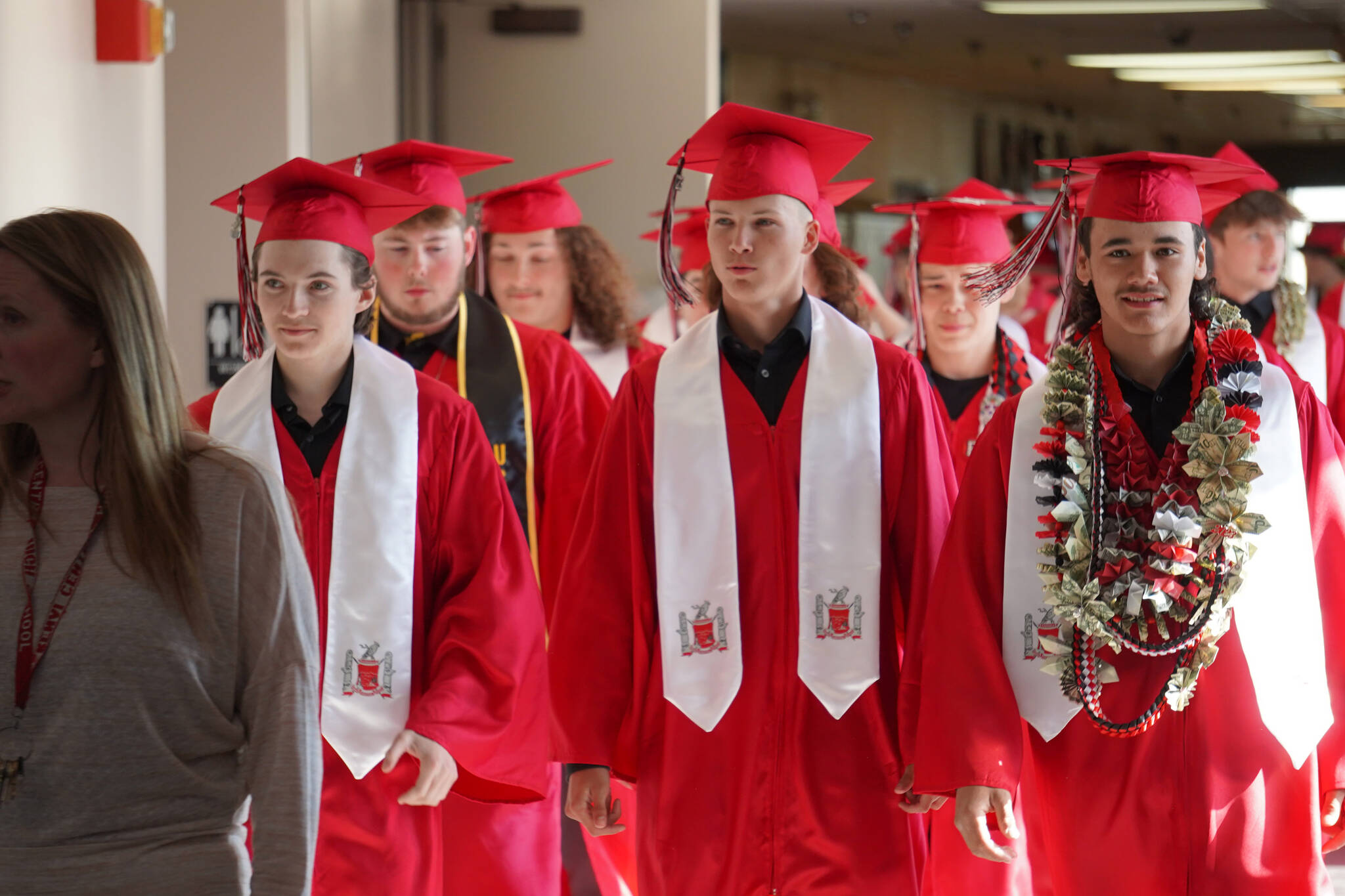 Kenai Central High School graduates prepare to enter the auditorium for their graduation ceremony on Wednesday, May 17, 2023, at Kenai Central High School in Kenai, Alaska. (Jake Dye/Peninsula Clarion)