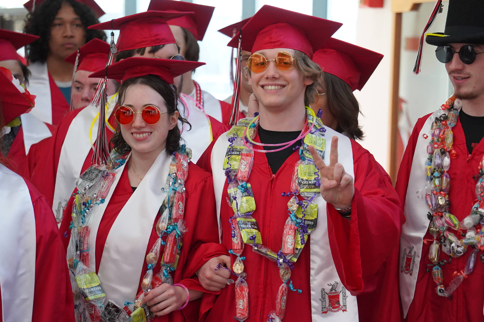 Ayla Tallent and Kage Adkins prepare to enter the auditorium for their graduation ceremony on Wednesday, May 17, 2023, at Kenai Central High School in Kenai, Alaska. (Jake Dye/Peninsula Clarion)