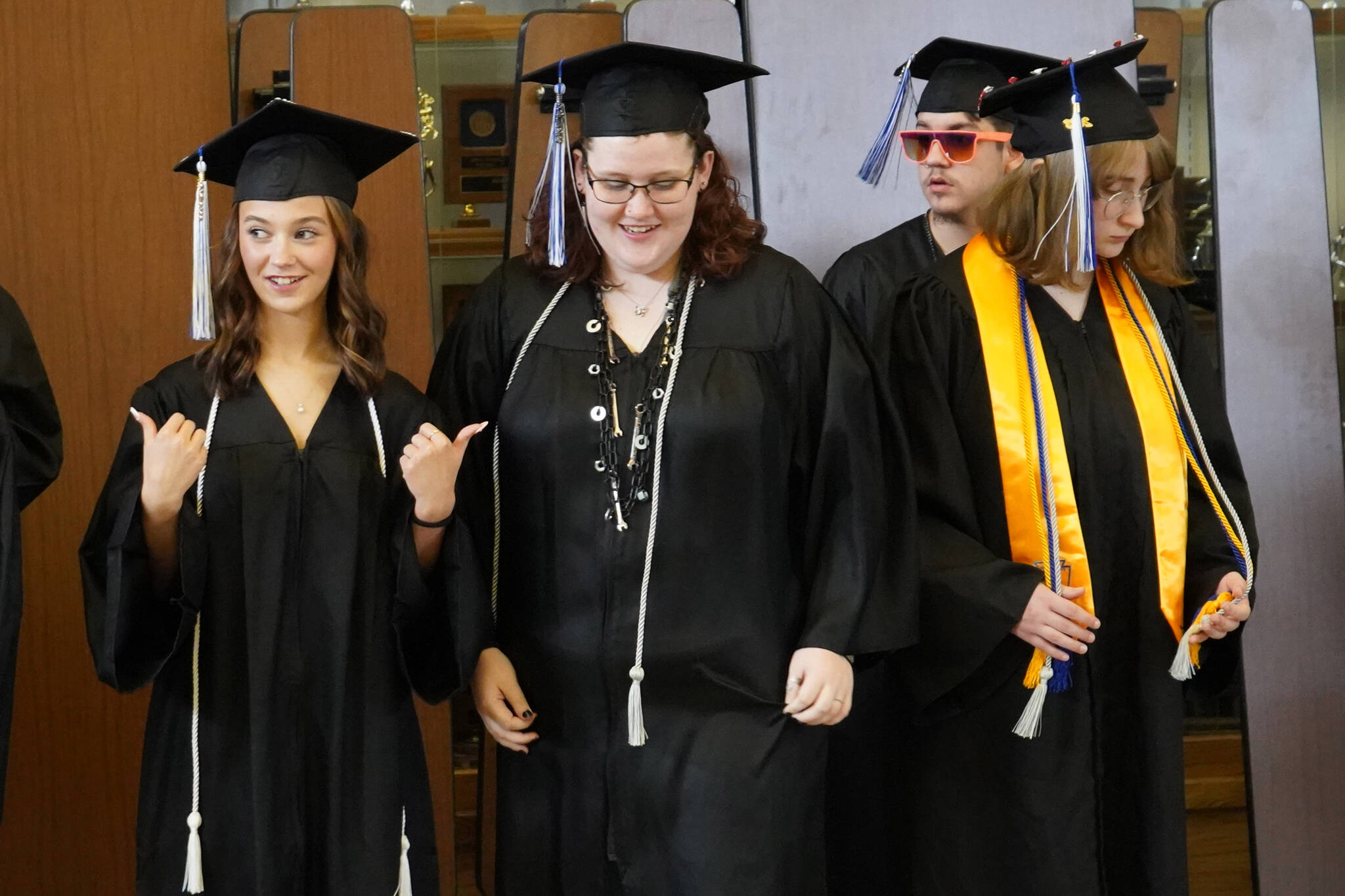 Connections Homeschool students prepare to enter the auditorium ahead of the Connections Homeschool graduation ceremony on Thursday, May 18, 2023, at Soldotna High School in Soldotna, Alaska. (Jake Dye/Peninsula Clarion)