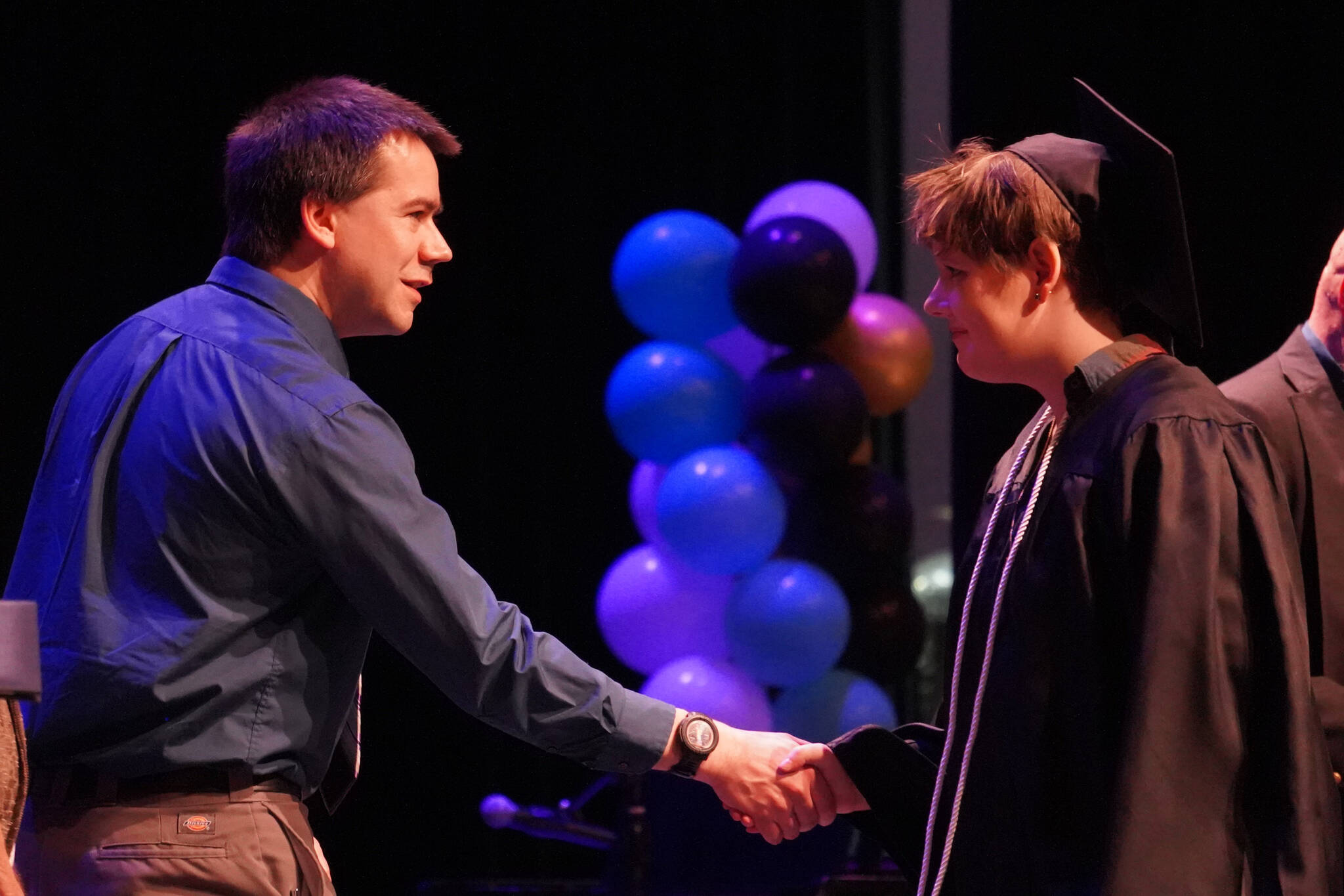 Connections Homeschool students take the stage to receive their diplomas during the Connections Homeschool graduation ceremony on Thursday, May 18, 2023, at Soldotna High School in Soldotna, Alaska. (Jake Dye/Peninsula Clarion)