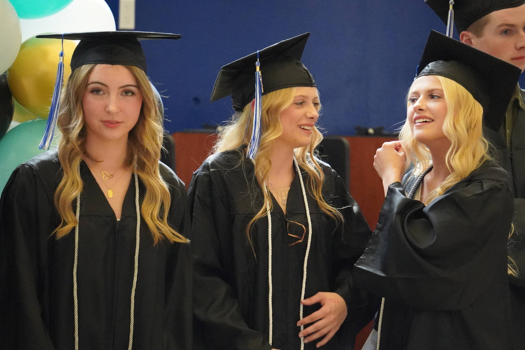 Connections Homeschool students prepare to enter the auditorium ahead of the Connections Homeschool graduation ceremony on Thursday, May 18, 2023, at Soldotna High School in Soldotna, Alaska. (Jake Dye/Peninsula Clarion)