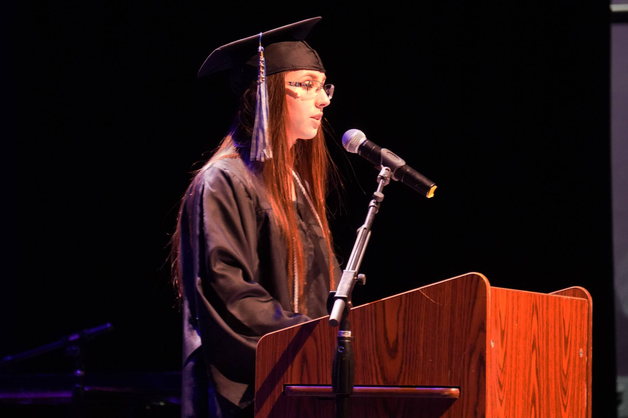 Willow Rediske recites a poem during the Connections Homeschool graduation ceremony on Thursday, May 18, 2023, at Soldotna High School in Soldotna, Alaska. (Jake Dye/Peninsula Clarion)