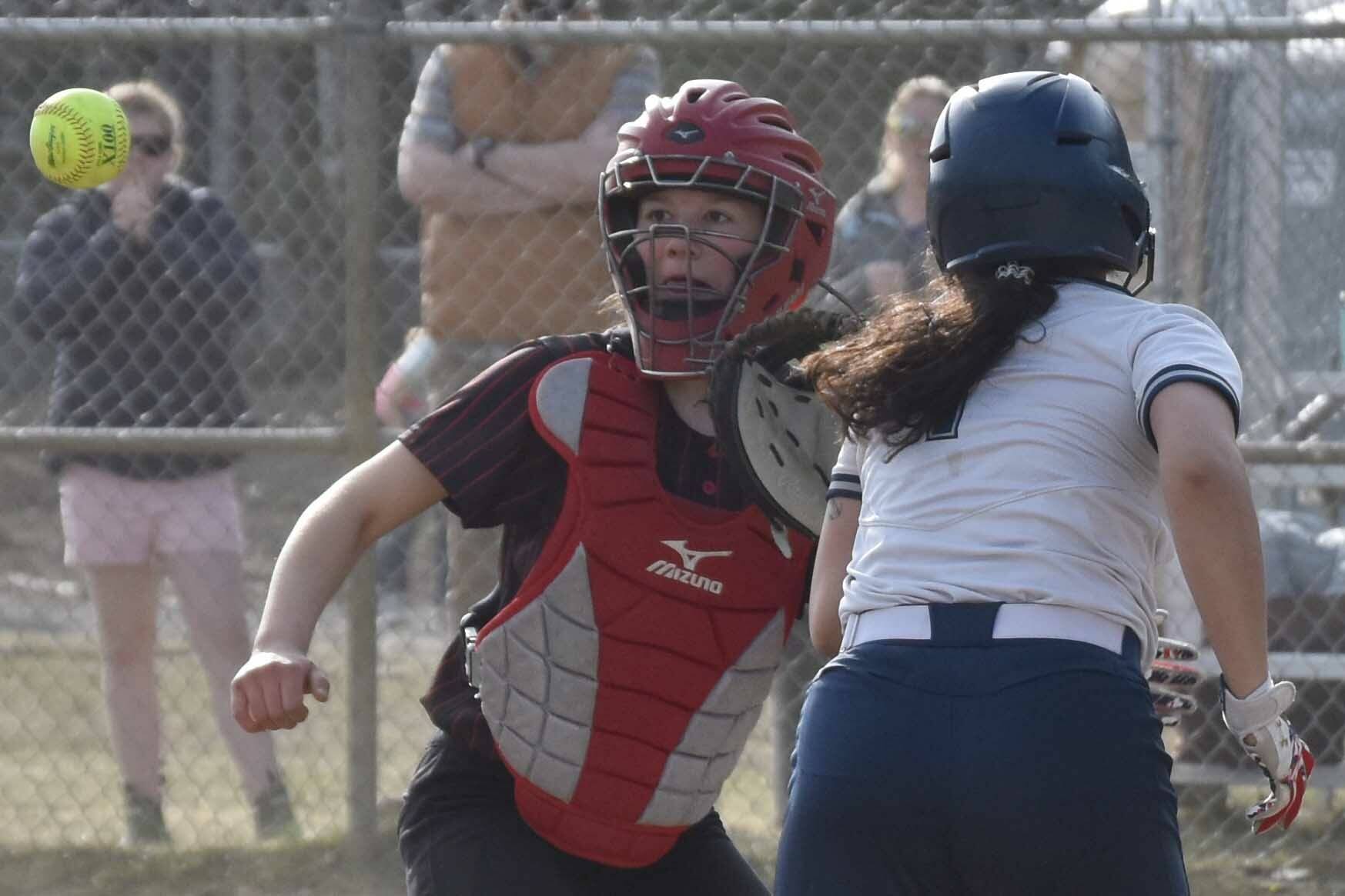 Kenai Central catcher Maggie Grenier gets ready to tag Soldotna's Miah Mead to end a rundown Thursday, May 18, 2023, at the Soldotna Little League fields in Soldotna, Alaska. (Photo by Jeff Helminiak/Peninsula Clarion)