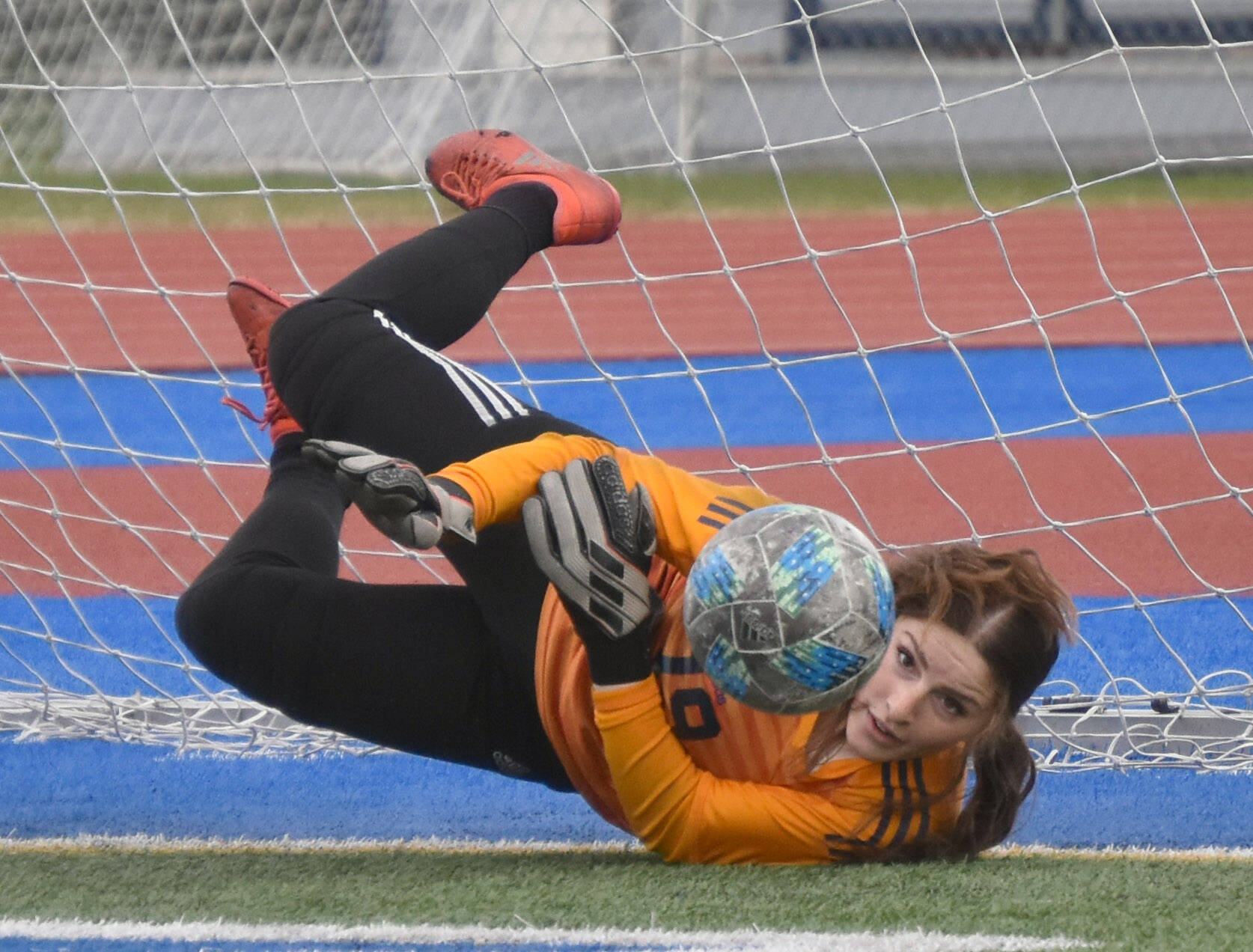 Homer goalie Felicia Weisser saves a penalty kick Friday, May 19, 2023, in the semifinals of the Peninsula Conference tournament at Justin Maile Field at Soldotna High School in Soldotna, Alaska. (Photo by Jeff Helminiak/Peninsula Clarion)