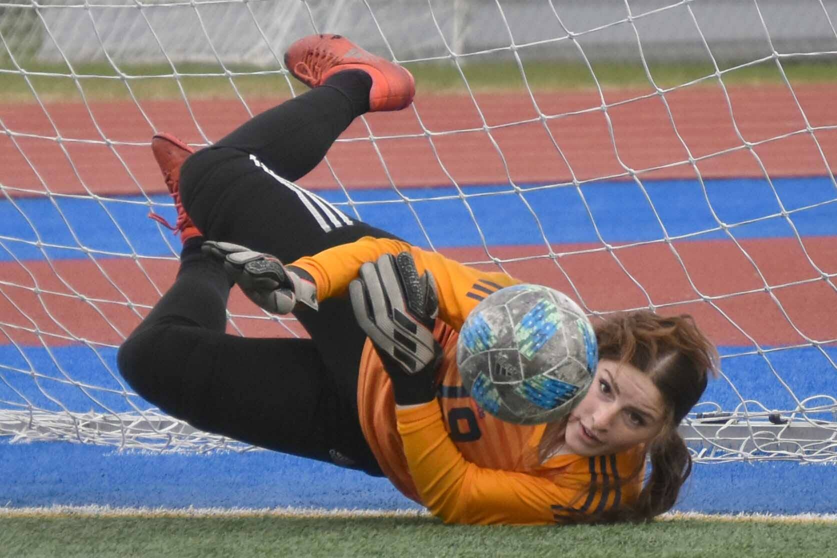 Homer goalie Felicia Weisser saves a penalty kick Friday, May 19, 2023, in the semifinals of the Peninsula Conference tournament at Justin Maile Field at Soldotna High School in Soldotna, Alaska. (Photo by Jeff Helminiak/Peninsula Clarion)